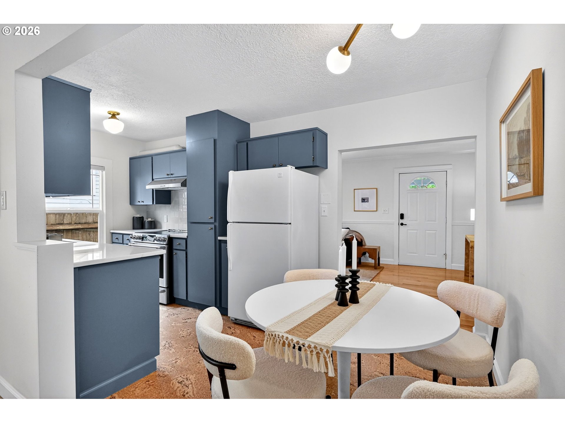 6128 Southeast Reedway Street Portland, OR 97206 - Photo 12 of 40 a living room with a sink and a refrigerator