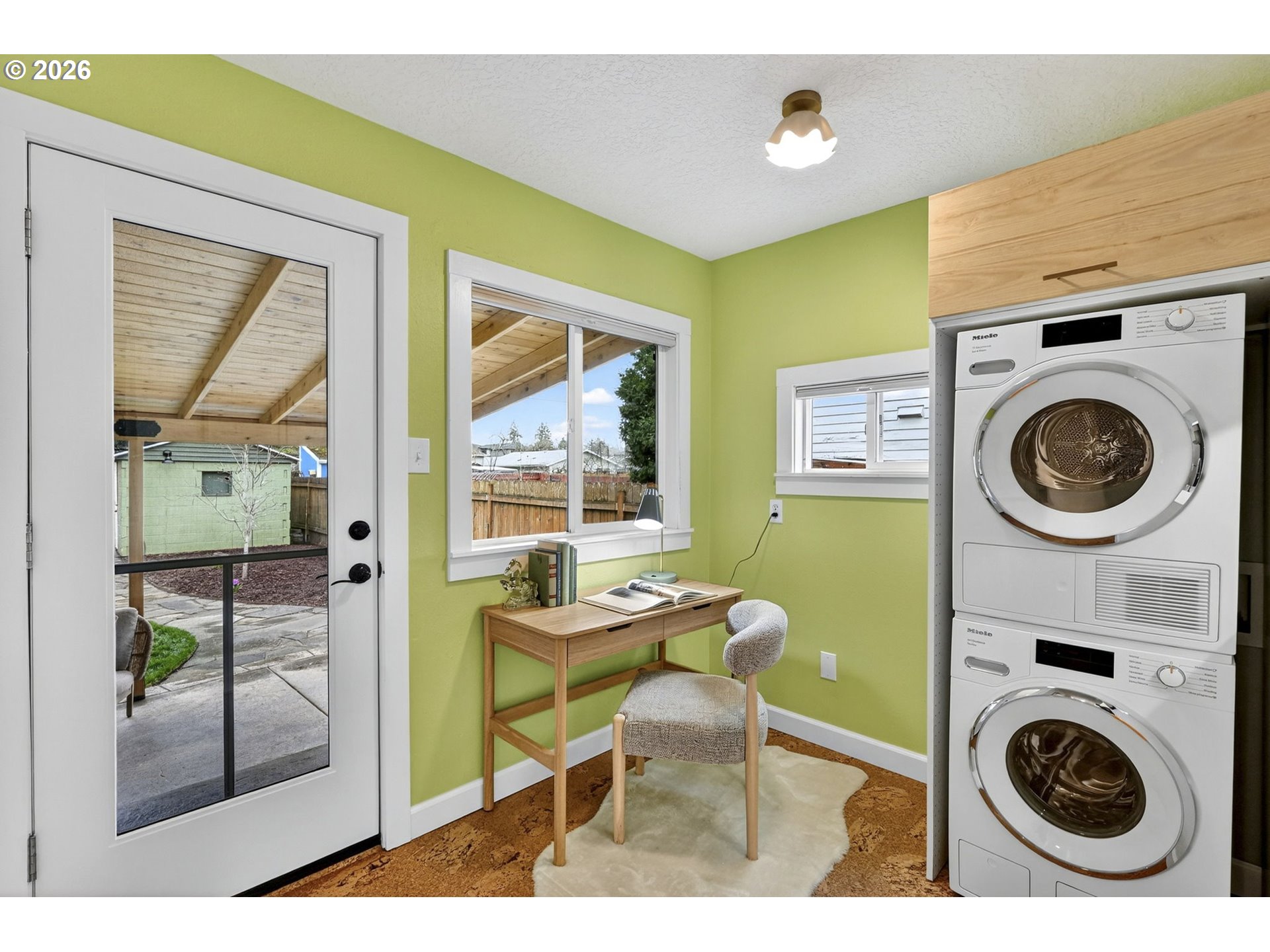 6128 Southeast Reedway Street Portland, OR 97206 - Photo 16 of 40 a view of a workspace with furniture and a window