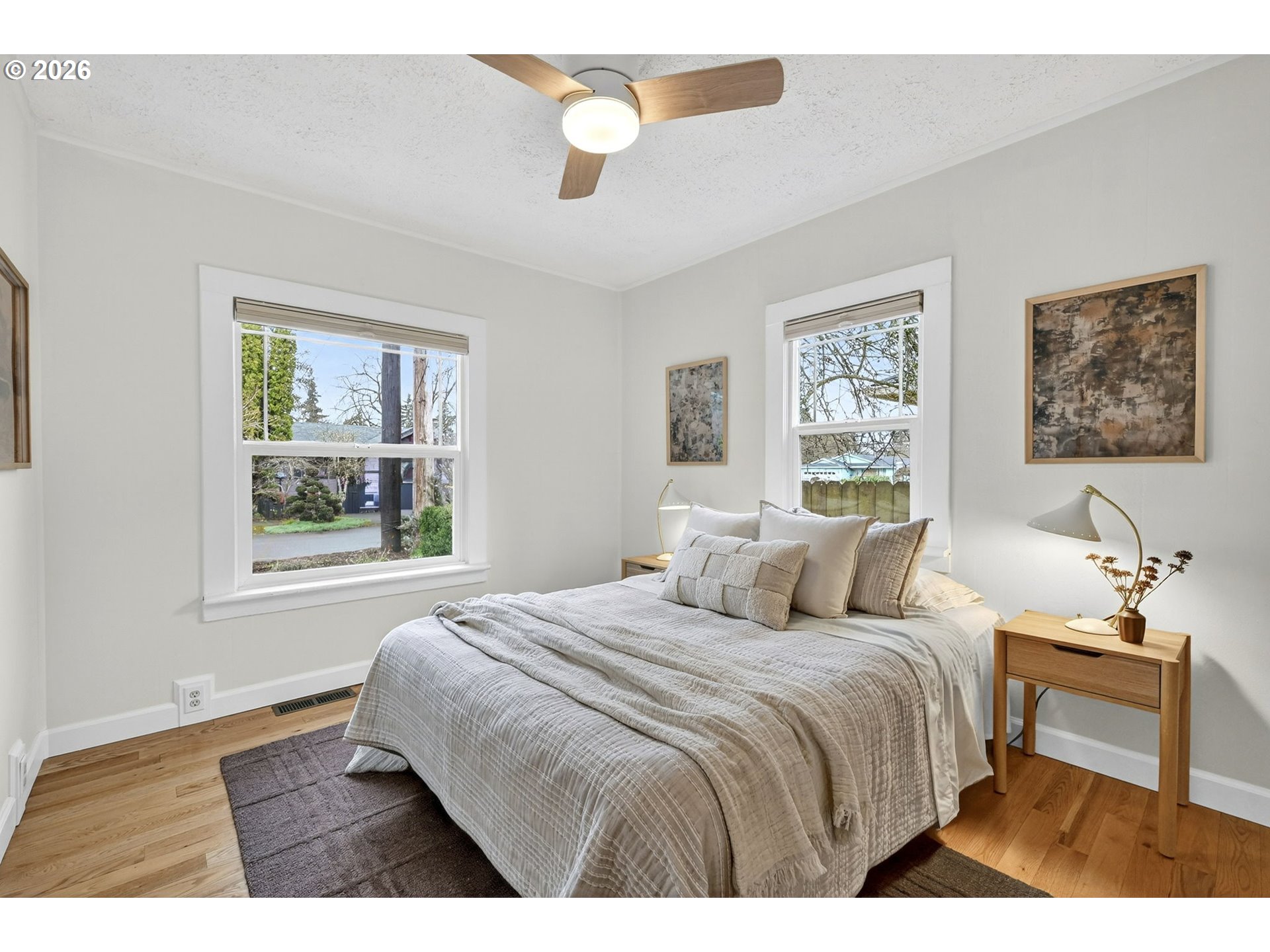 6128 Southeast Reedway Street Portland, OR 97206 - Photo 17 of 40 a bedroom with a bed and a window