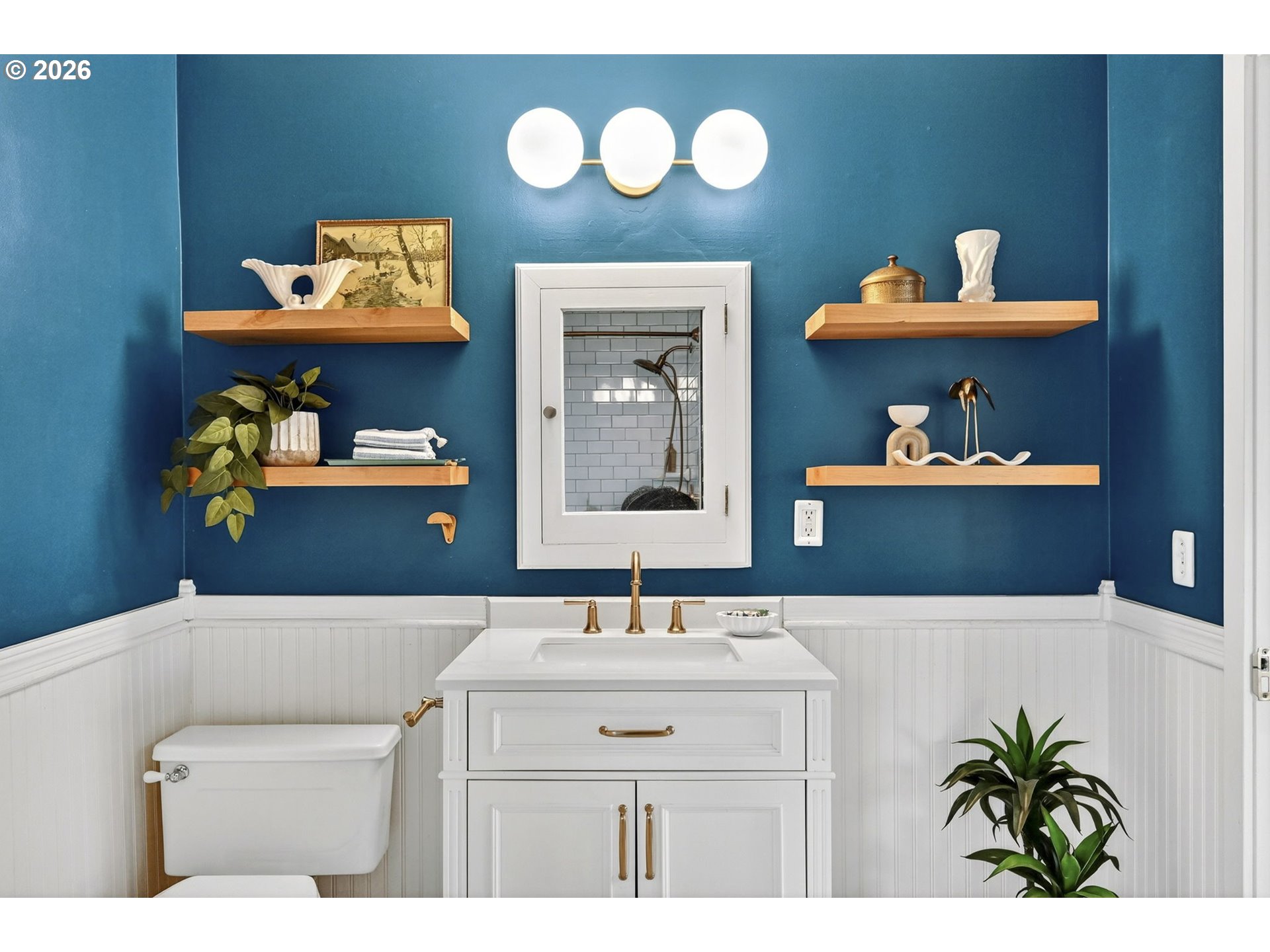 6128 Southeast Reedway Street Portland, OR 97206 - Photo 22 of 40 a bathroom with a sink and a mirror