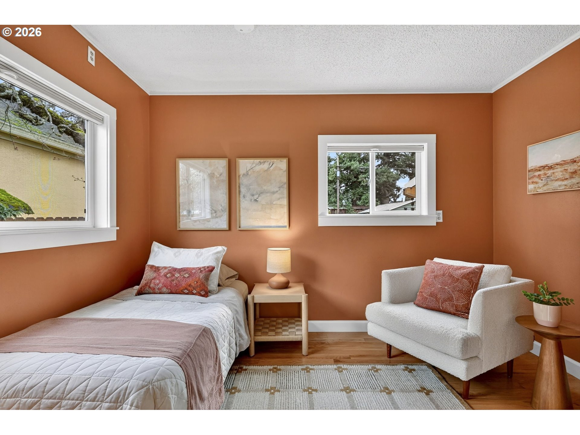 6128 Southeast Reedway Street Portland, OR 97206 - Photo 24 of 40 a bedroom with furniture and a window