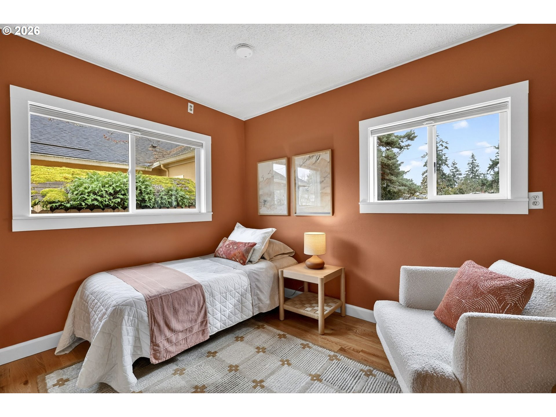 6128 Southeast Reedway Street Portland, OR 97206 - Photo 25 of 40 a bedroom with a bed and a large window