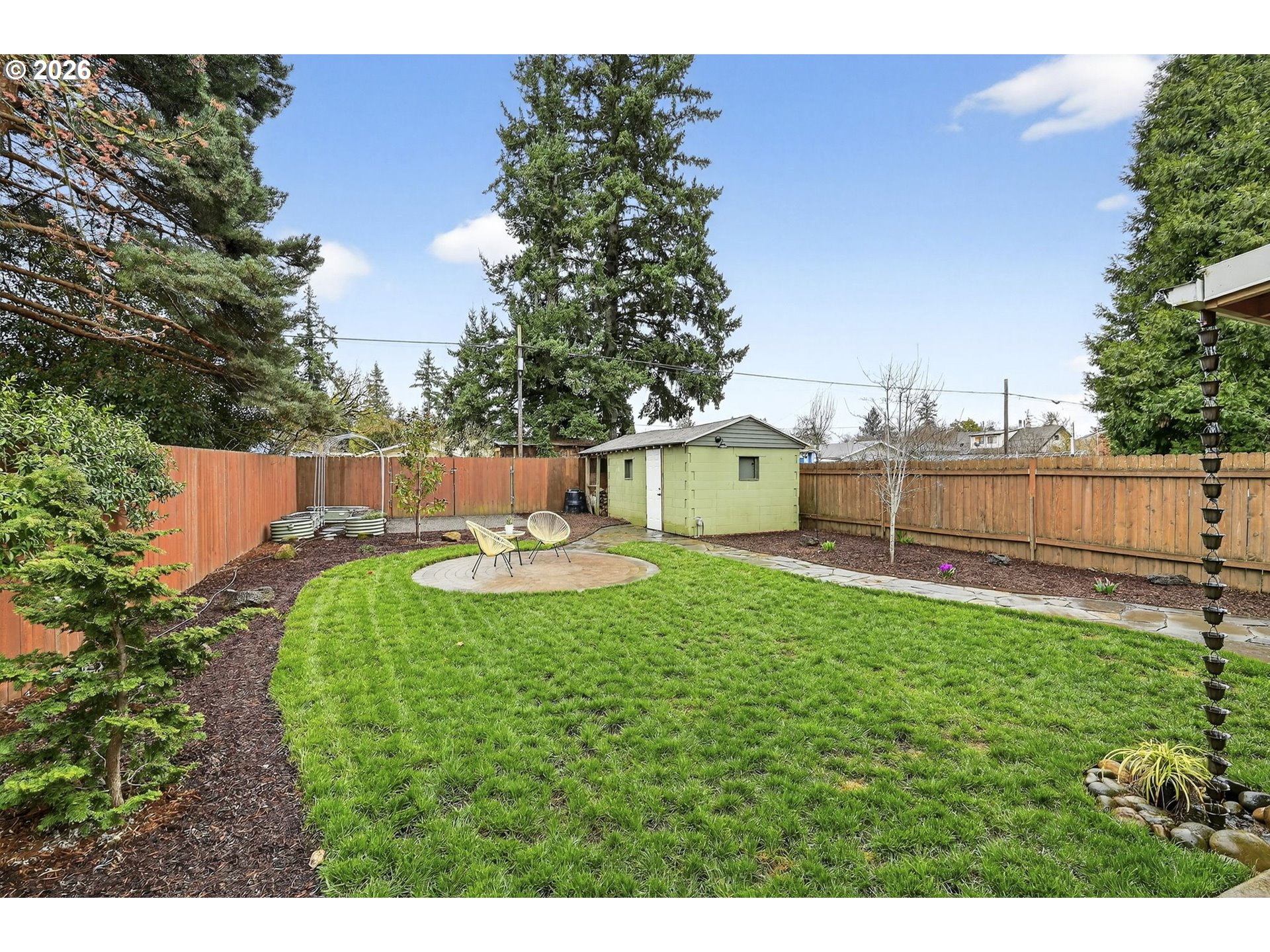 6128 Southeast Reedway Street Portland, OR 97206 - Photo 31 of 40 a view of backyard with swimming pool and seating space
