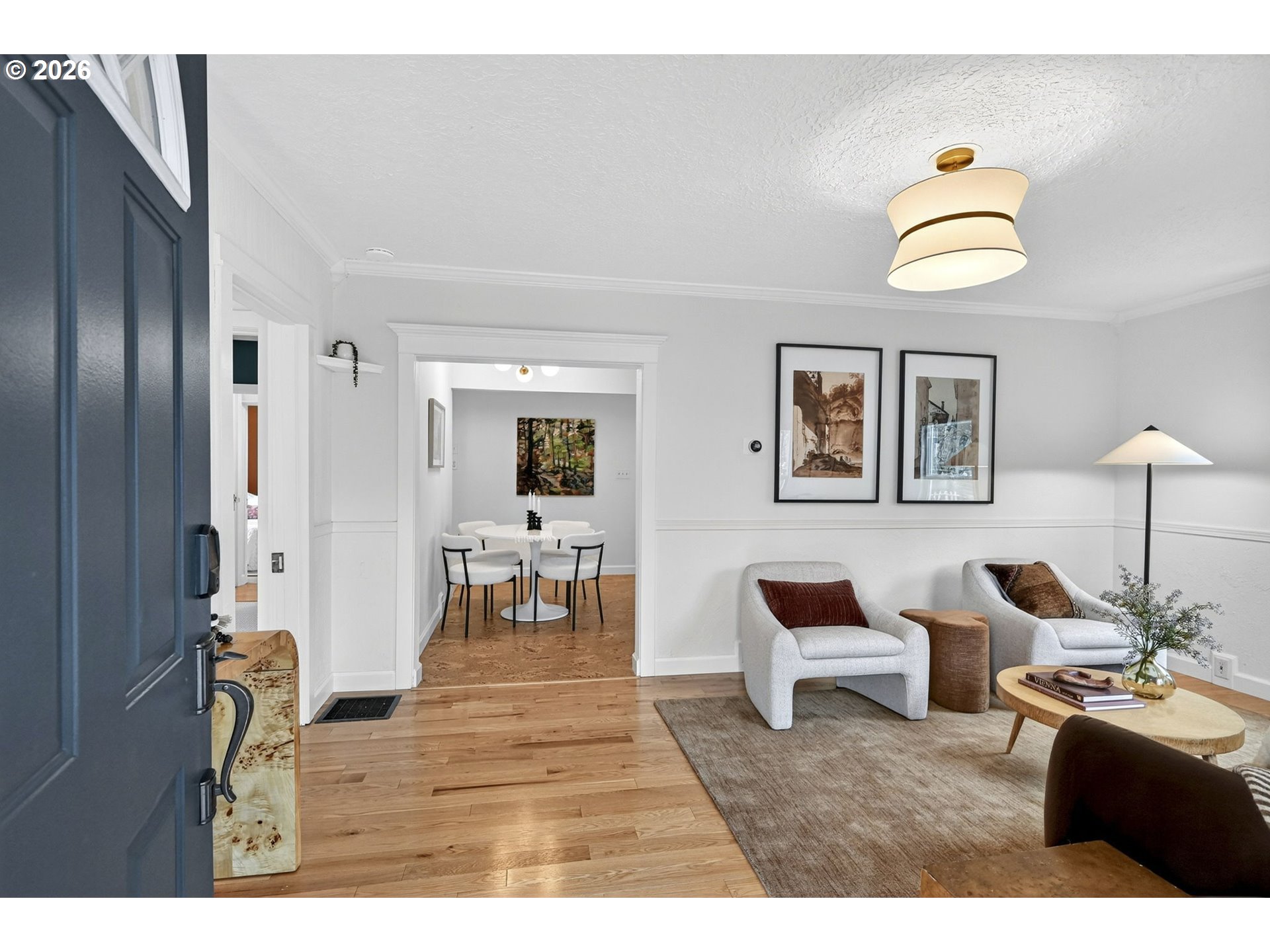 6128 Southeast Reedway Street Portland, OR 97206 - Photo 6 of 40 a living room with furniture and a lamp