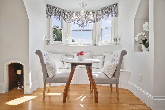a view of a dining room with furniture window and wooden floor