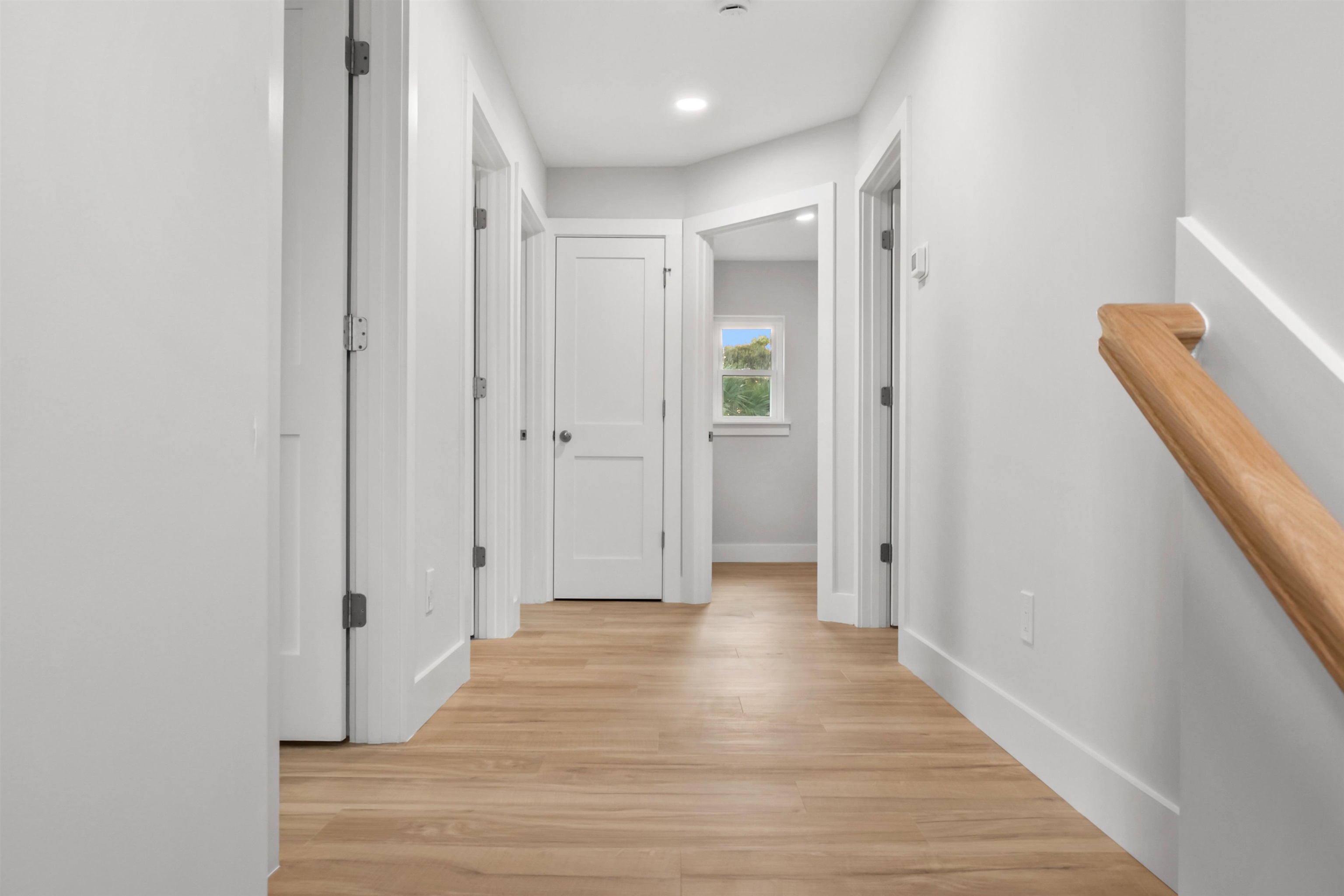137 Ferrol Road St. Augustine, FL 32084 - Photo 33 of 53 a view of a hallway with wooden floor and staircase