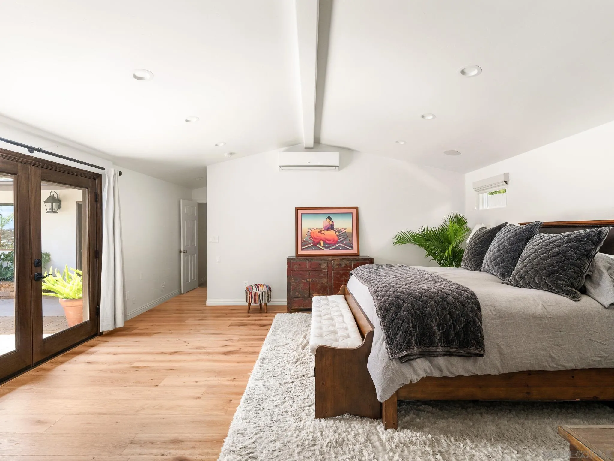 331 Glencrest Drive Solana Beach, CA 92075 - Photo 11 of 43 a bedroom with a bed and a chandelier