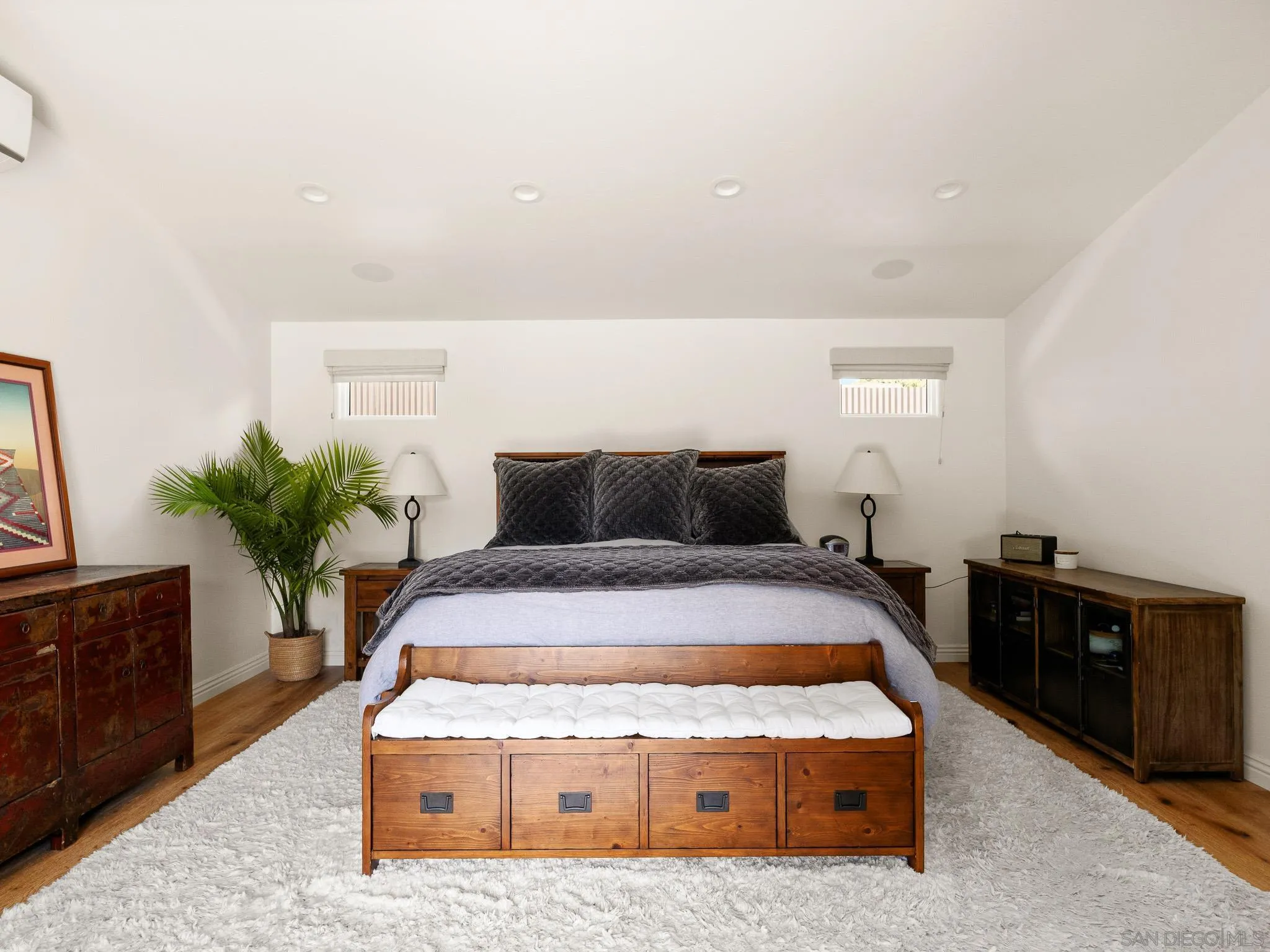 331 Glencrest Drive Solana Beach, CA 92075 - Photo 12 of 43 a spacious bedroom with a bed and a potted plant