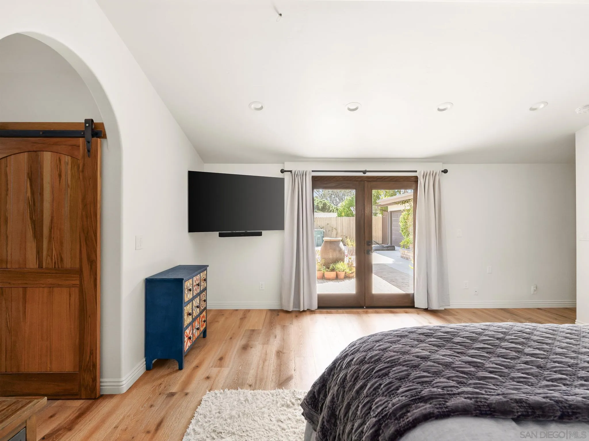 331 Glencrest Drive Solana Beach, CA 92075 - Photo 15 of 43 a bedroom with a bed and a flat screen tv