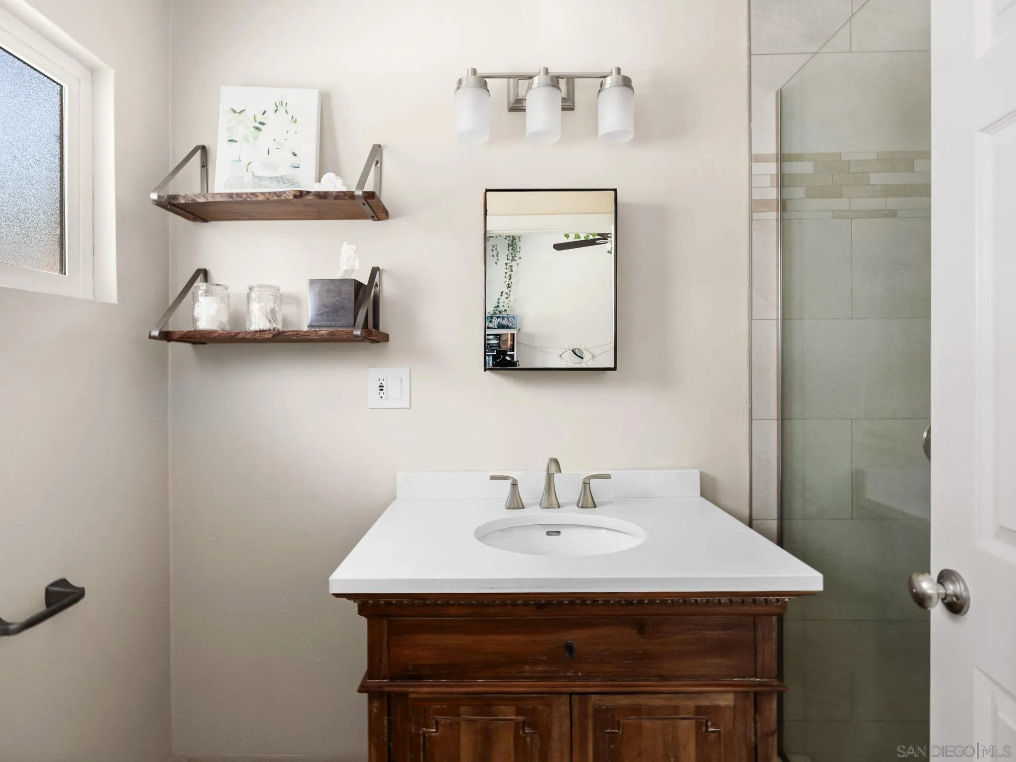 331 Glencrest Drive Solana Beach, CA 92075 - Photo 22 of 43 a bathroom with a sink and a mirror