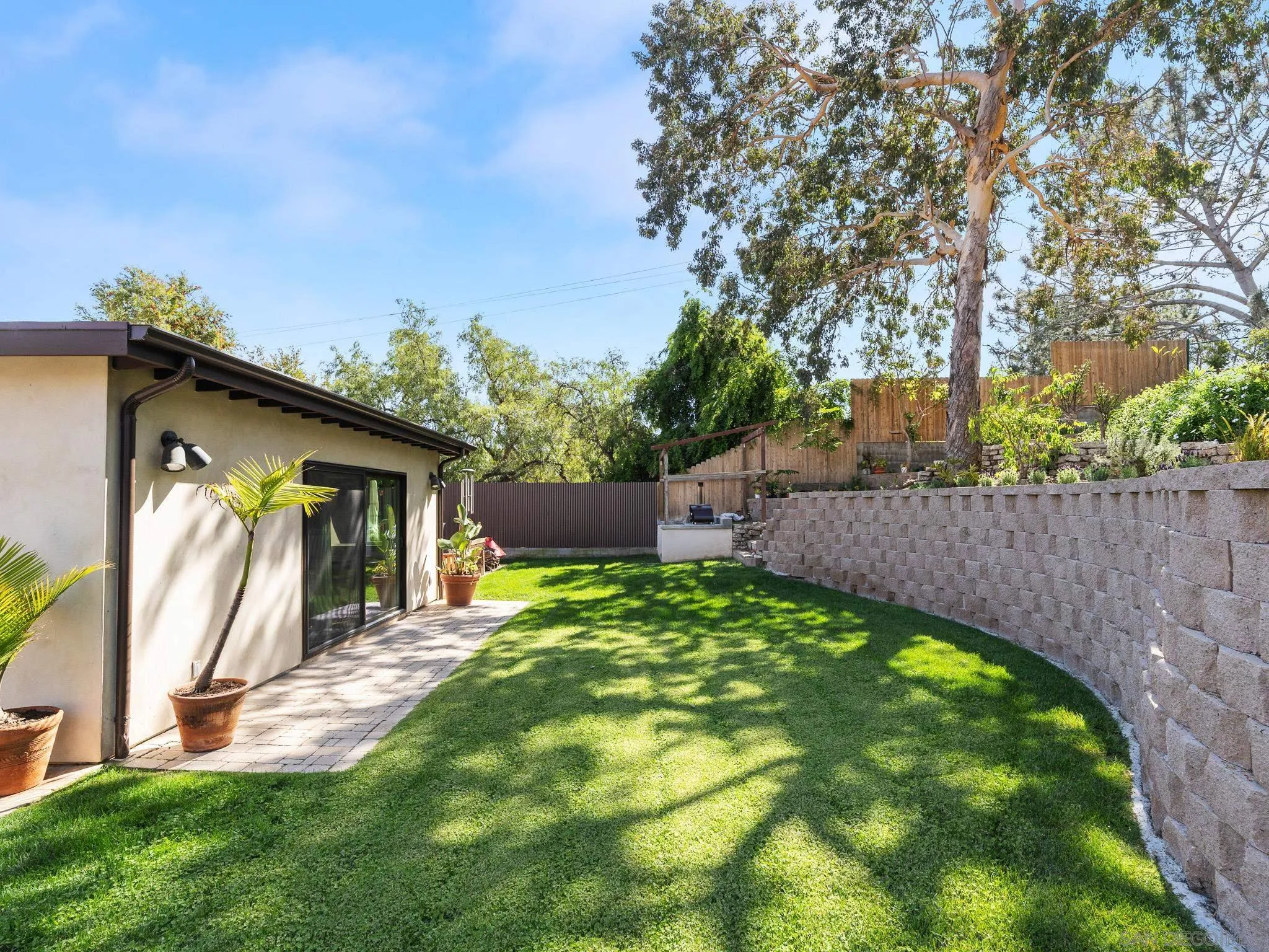 331 Glencrest Drive Solana Beach, CA 92075 - Photo 27 of 43 a backyard of a house with table and chairs