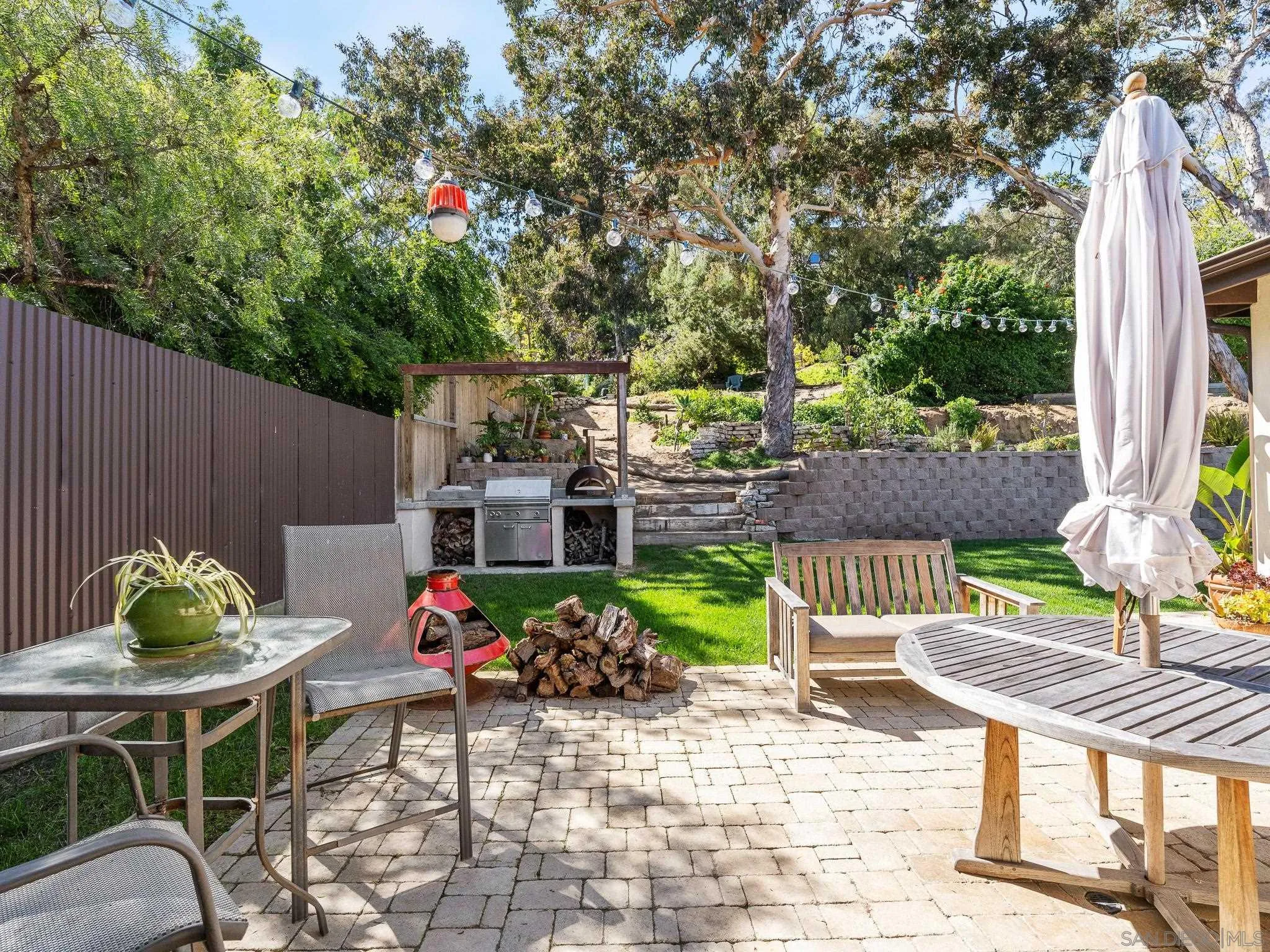 331 Glencrest Drive Solana Beach, CA 92075 - Photo 28 of 43 a view of outdoor dining space with a patio table and chairs