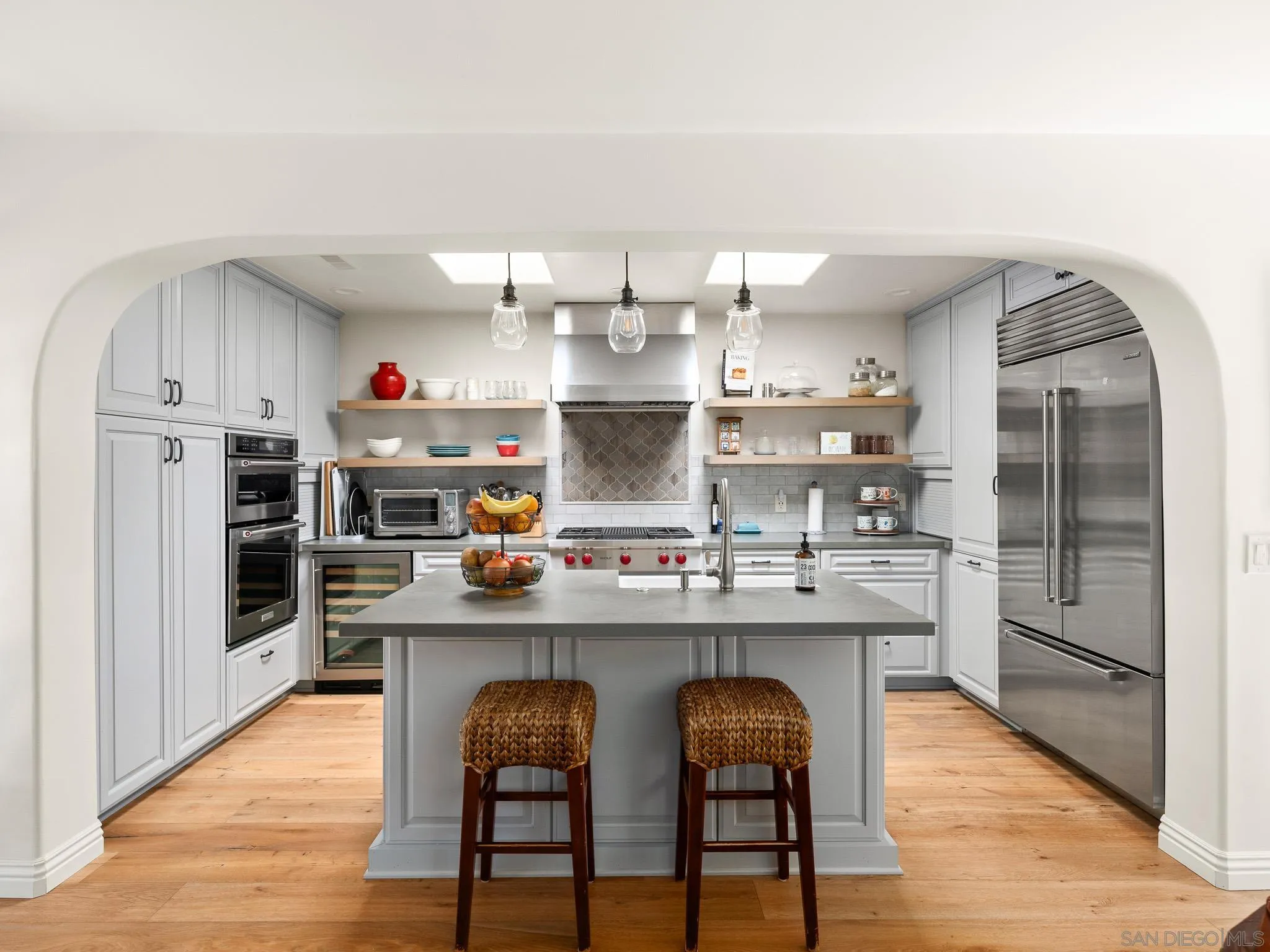 331 Glencrest Drive Solana Beach, CA 92075 - Photo 5 of 43 a kitchen with stainless steel appliances granite countertop a sink and refrigerator