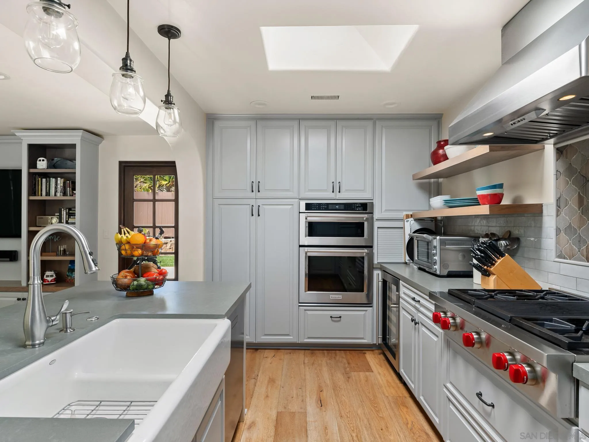 331 Glencrest Drive Solana Beach, CA 92075 - Photo 6 of 43 a kitchen with stainless steel appliances granite countertop a sink and a stove