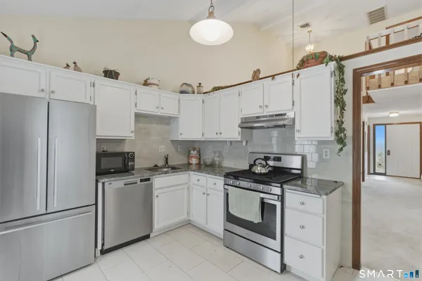 a bathroom with a toilet a sink and a mirror