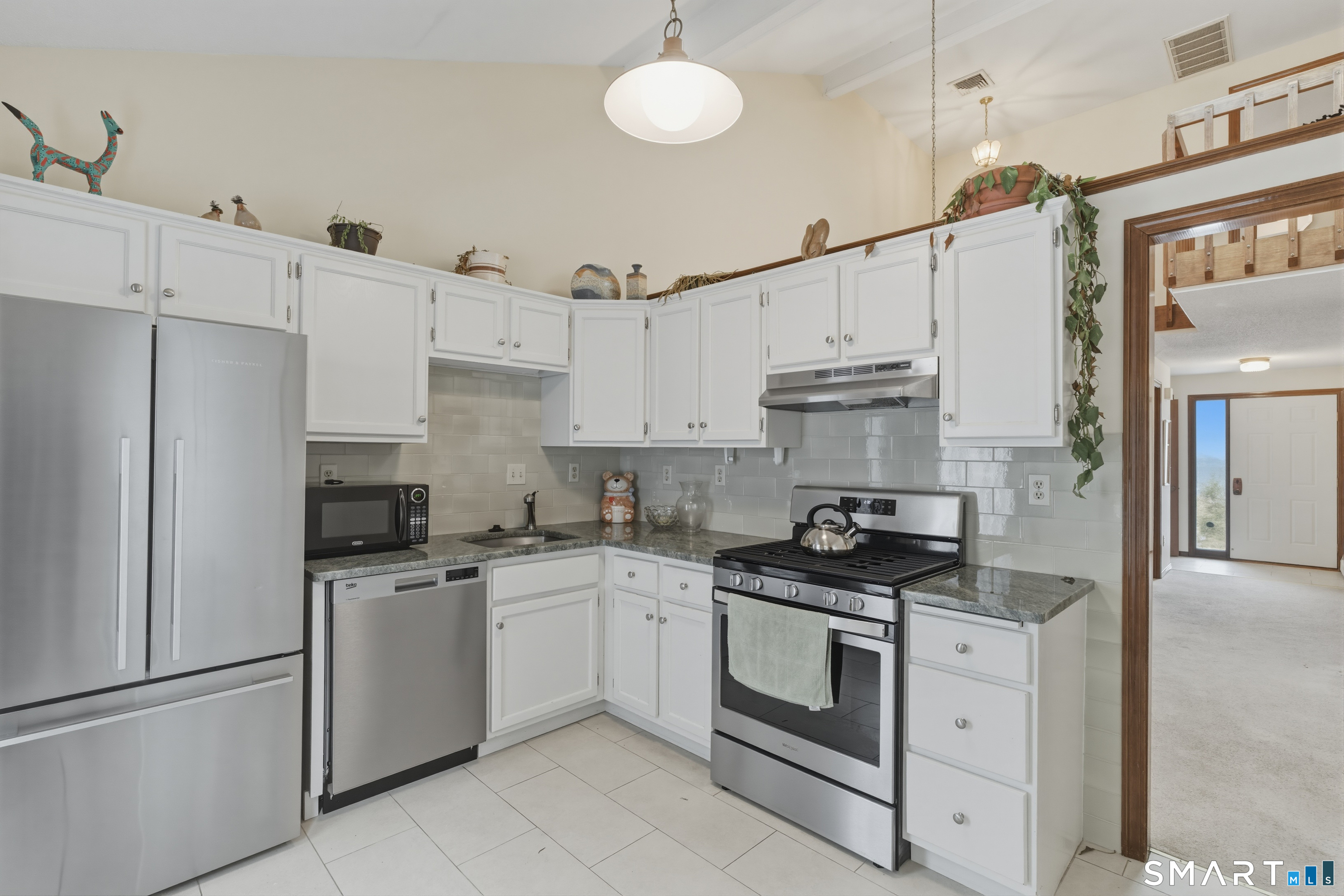 15 Potter Crossing, Unit 15 Wethersfield, CT 06109 - Photo 11 of 21 a kitchen with cabinets stainless steel appliances and a counter space