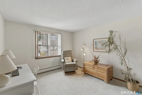 a bedroom with a bed and furniture