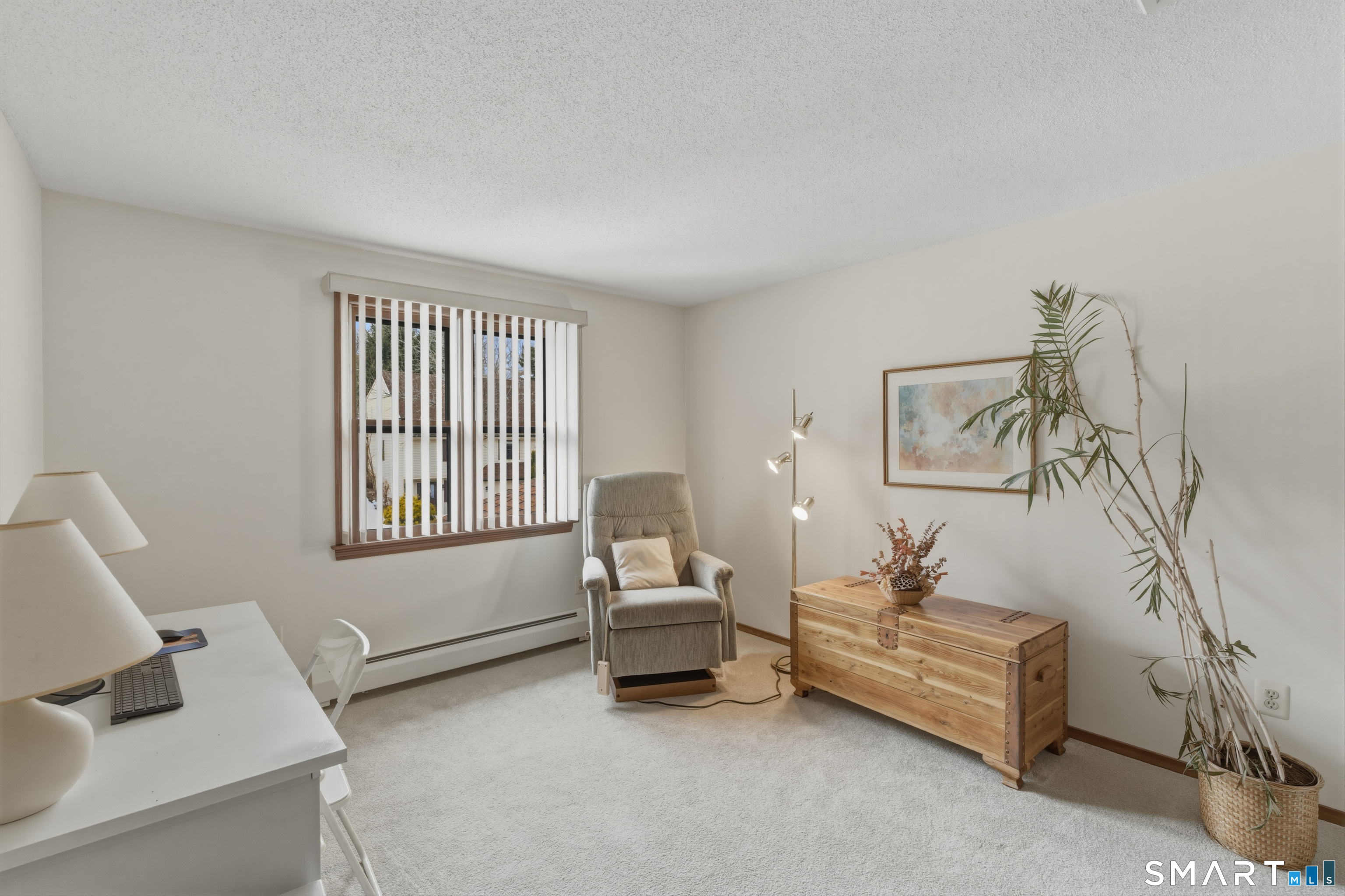 15 Potter Crossing, Unit 15 Wethersfield, CT 06109 - Photo 15 of 21 a living room with furniture and a window