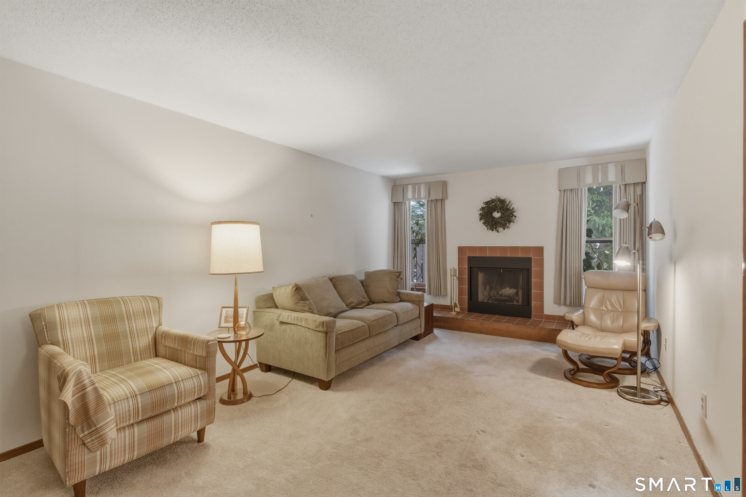 15 Potter Crossing, Unit 15 Wethersfield, CT 06109 - Photo 6 of 21 a living room with furniture and a fireplace
