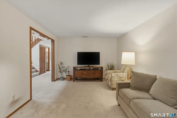 a view of a livingroom with furniture and a fireplace