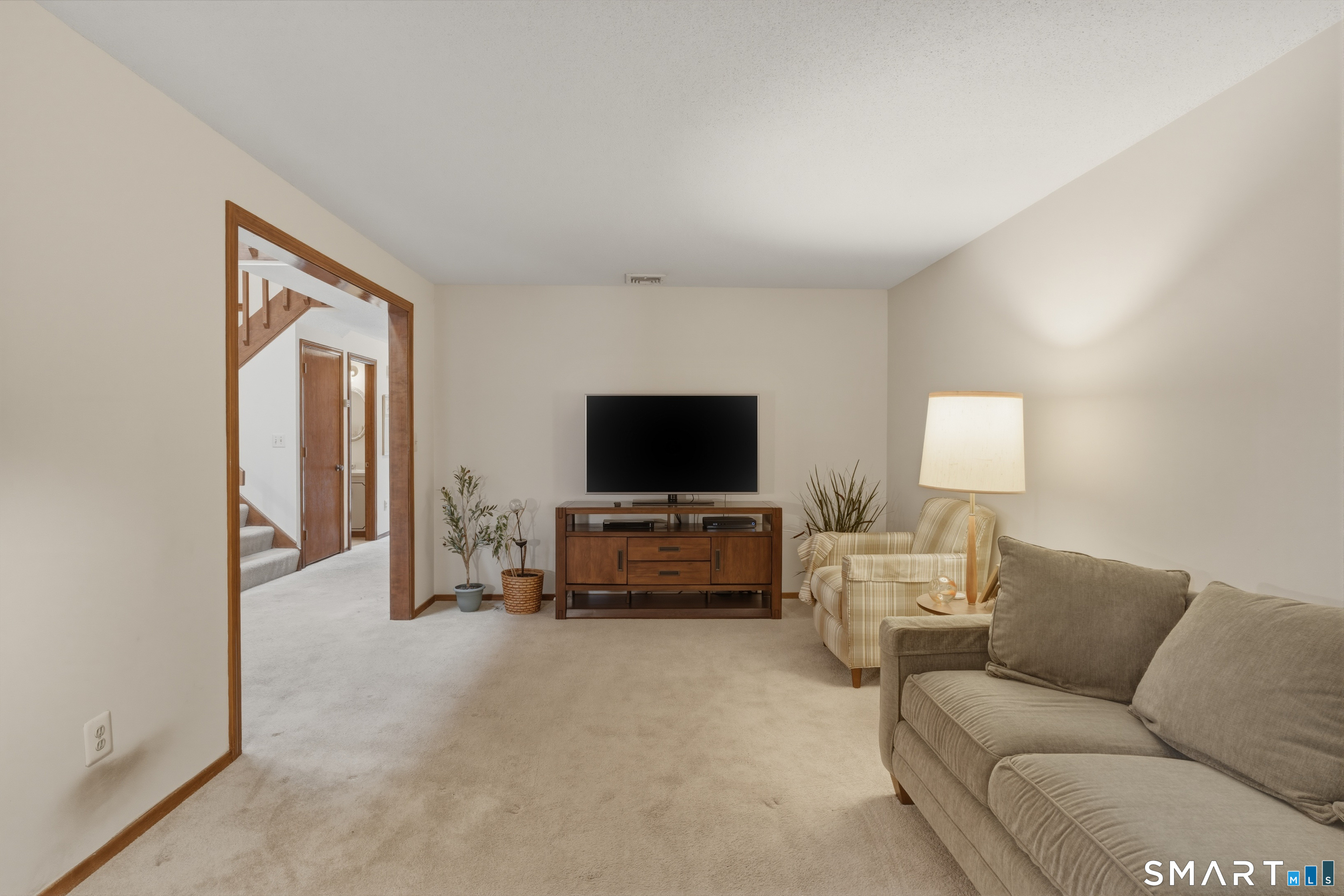 15 Potter Crossing, Unit 15 Wethersfield, CT 06109 - Photo 7 of 21 a living room with furniture and a flat screen tv