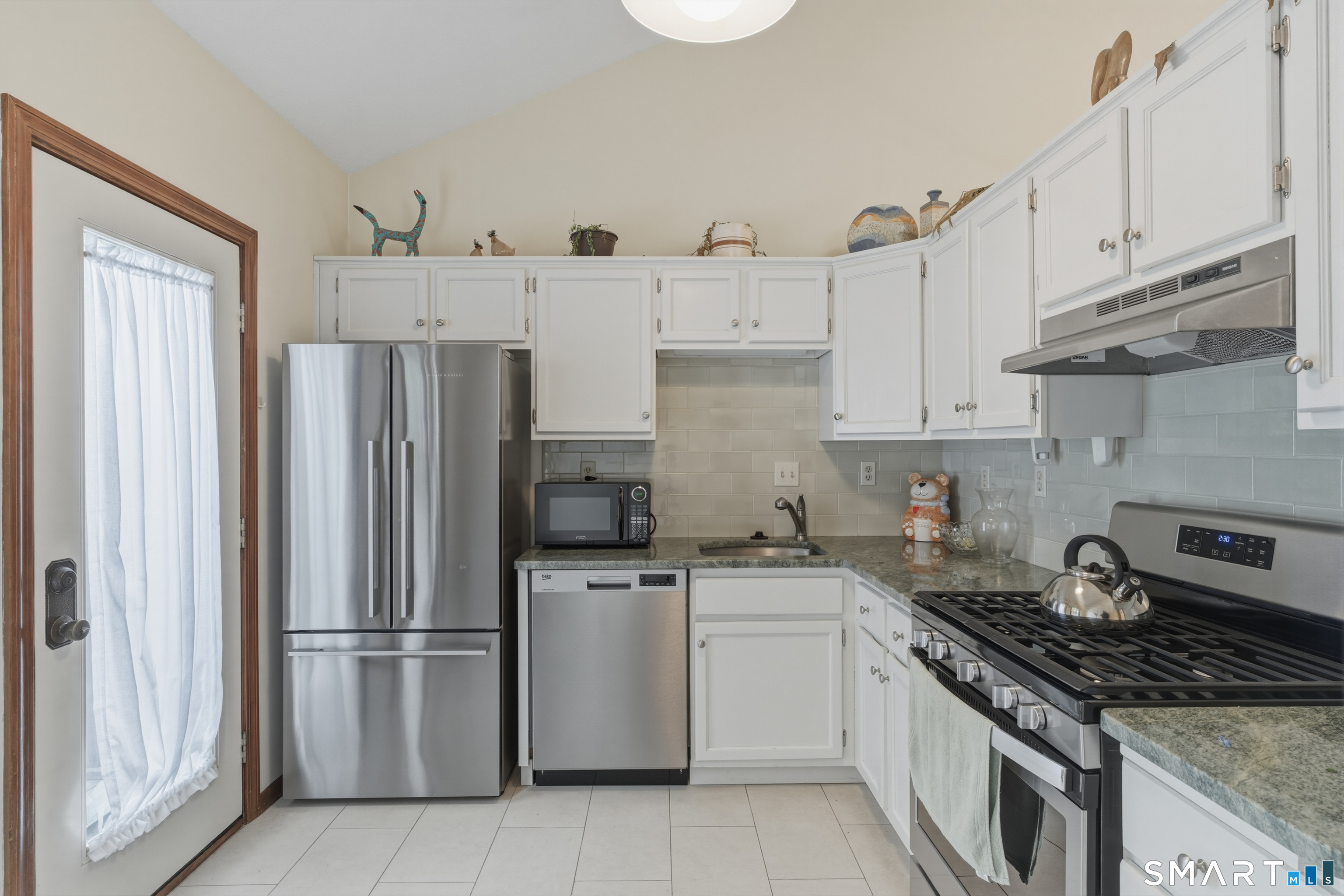 15 Potter Crossing, Unit 15 Wethersfield, CT 06109 - Photo 10 of 21 a kitchen with cabinets a refrigerator and a sink