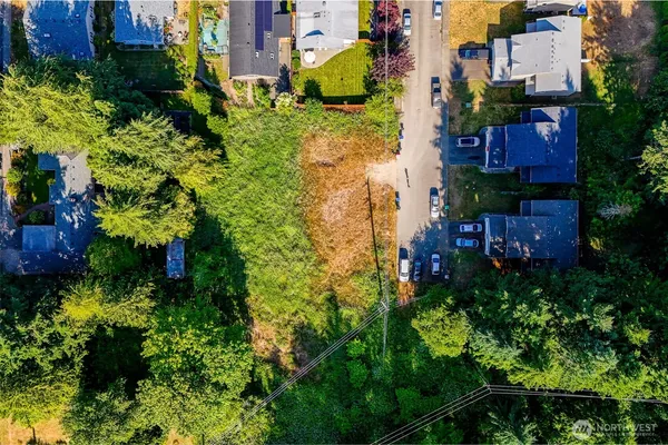 an aerial view of a house with a yard