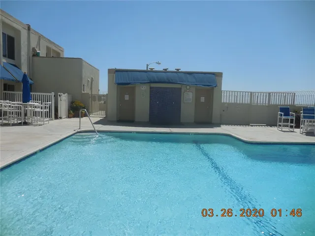 a view of a chairs and table in a terrace