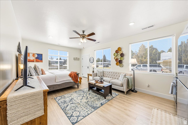 357 East Main Street Enterprise, UT 84725 - Photo 46 of 71 Bedroom with light wood finished floors and a ceiling fan