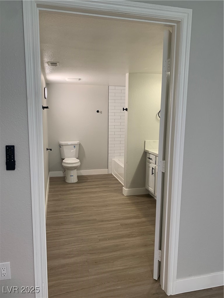 8101 West Flamingo Road, Unit 1102 Las Vegas, NV 89147 - Photo 52 of 54 Full bath with vanity and wood finished floors