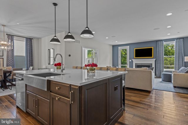 a kitchen with sink stove and cabinets