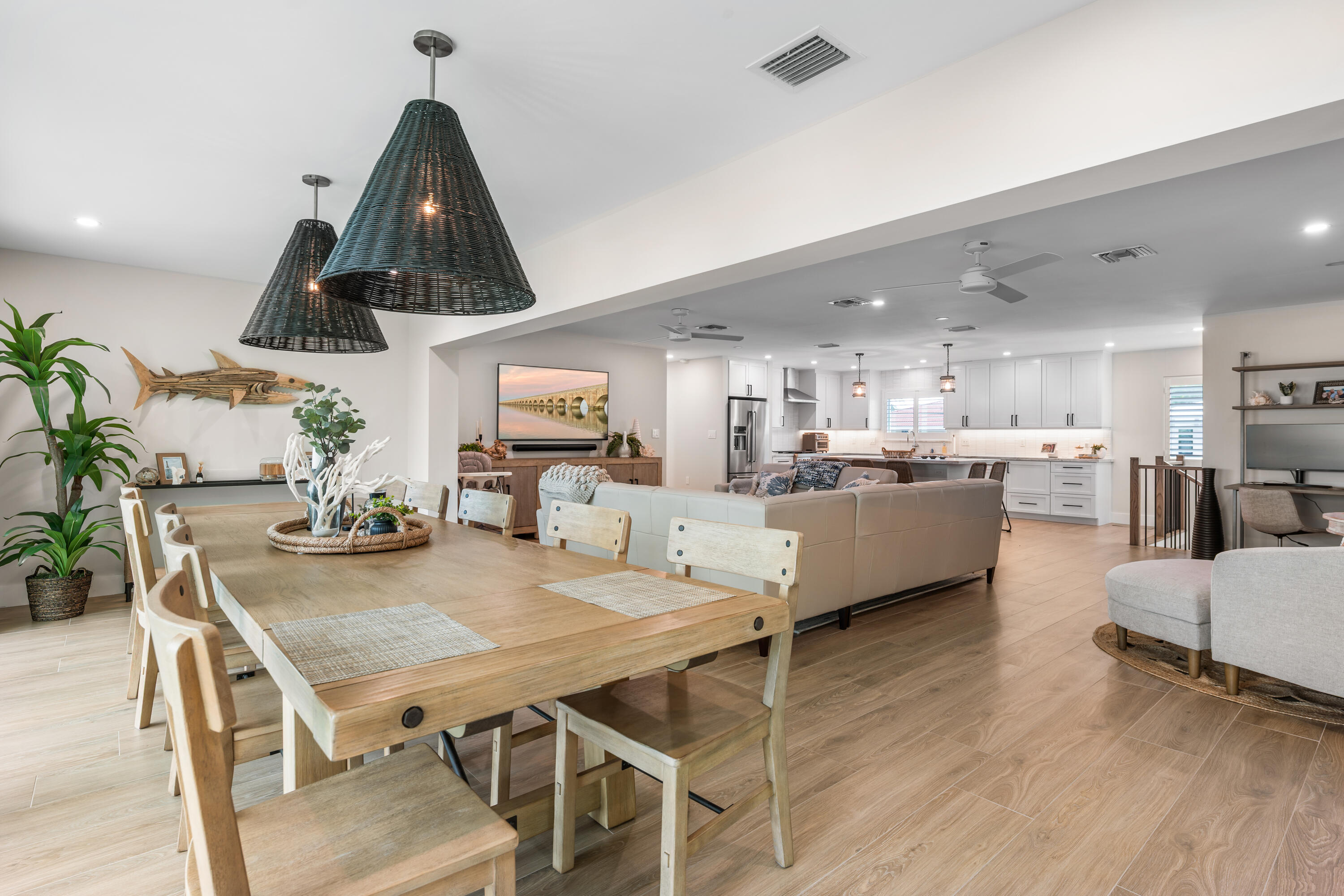 360 12th Street Key Colony Beach, FL 33051 - Photo 19 of 60 a view of a dining room with furniture and wooden floor