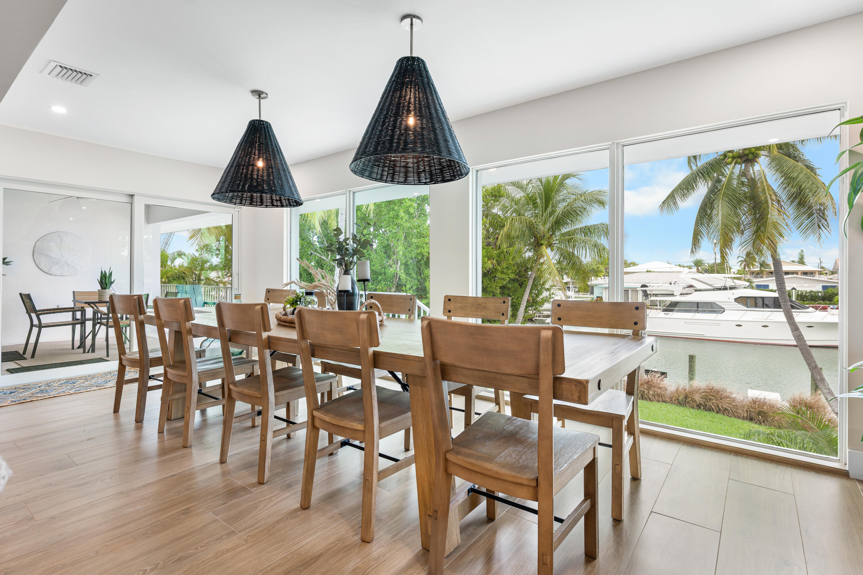 360 12th Street Key Colony Beach, FL 33051 - Photo 20 of 60 a dining room with furniture window and wooden floor