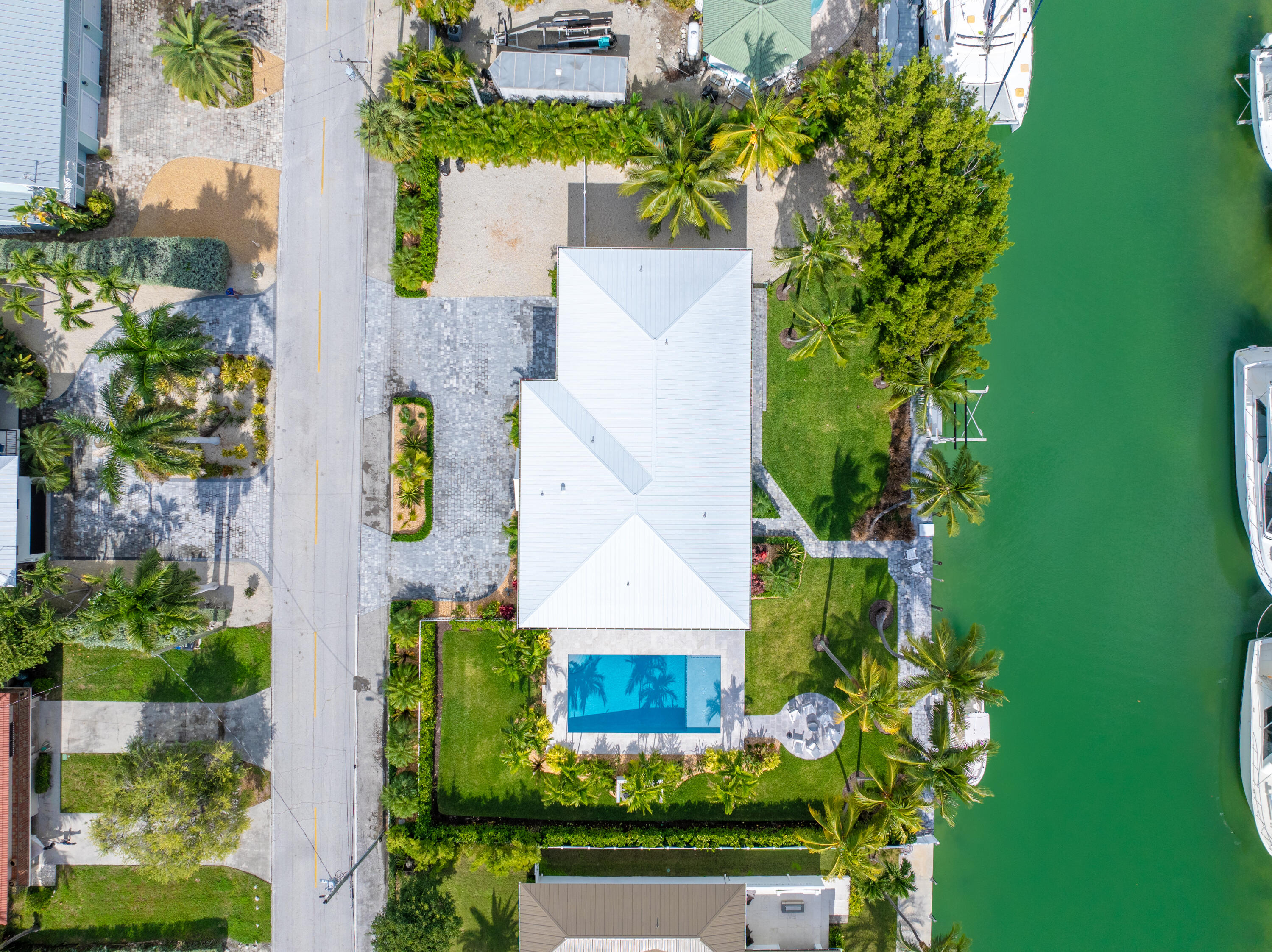 360 12th Street Key Colony Beach, FL 33051 - Photo 2 of 60 an aerial view of a house with a yard swimming pool and outdoor seating