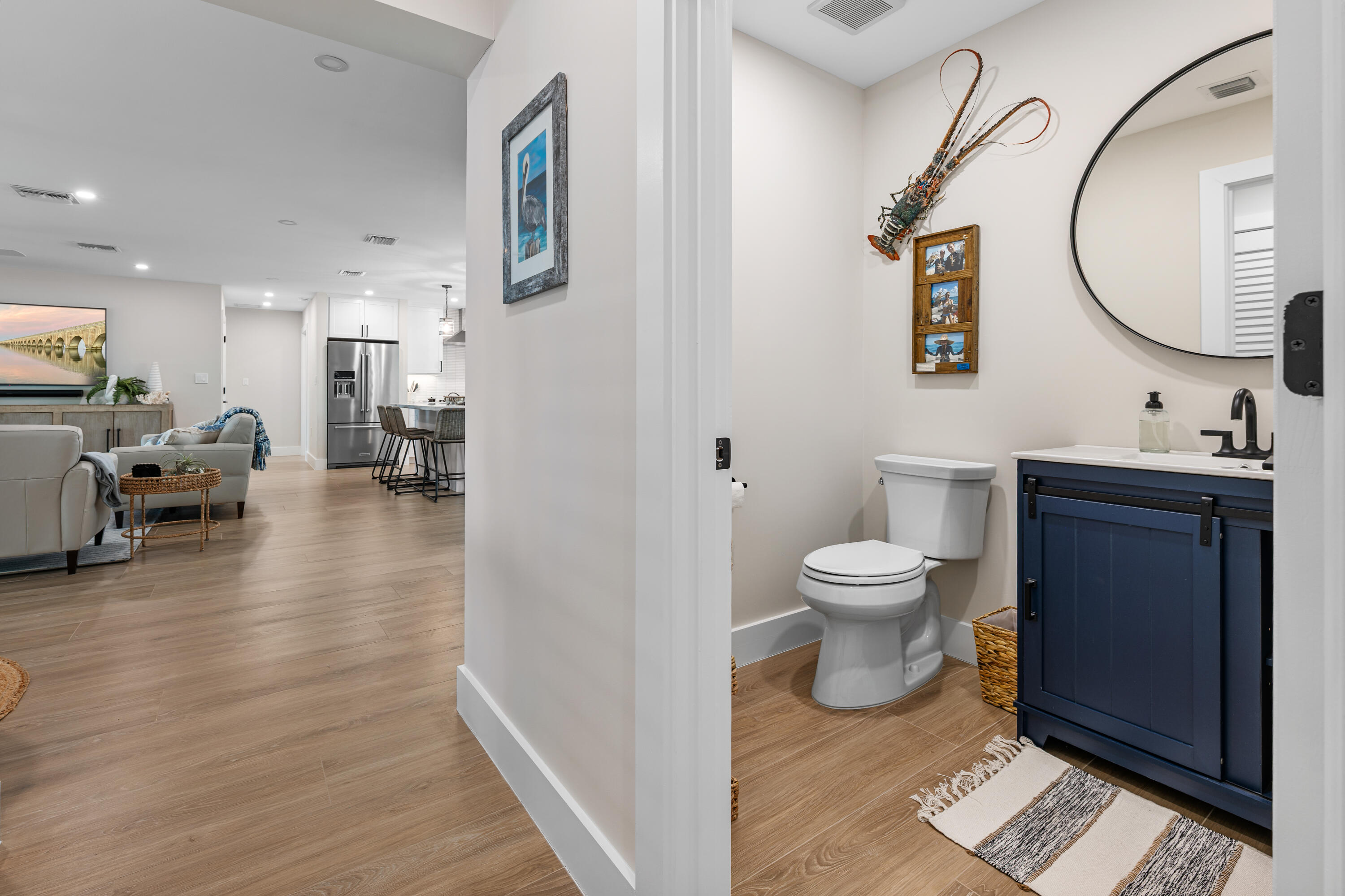 360 12th Street Key Colony Beach, FL 33051 - Photo 24 of 60 a bathroom with a toilet a sink and a mirror