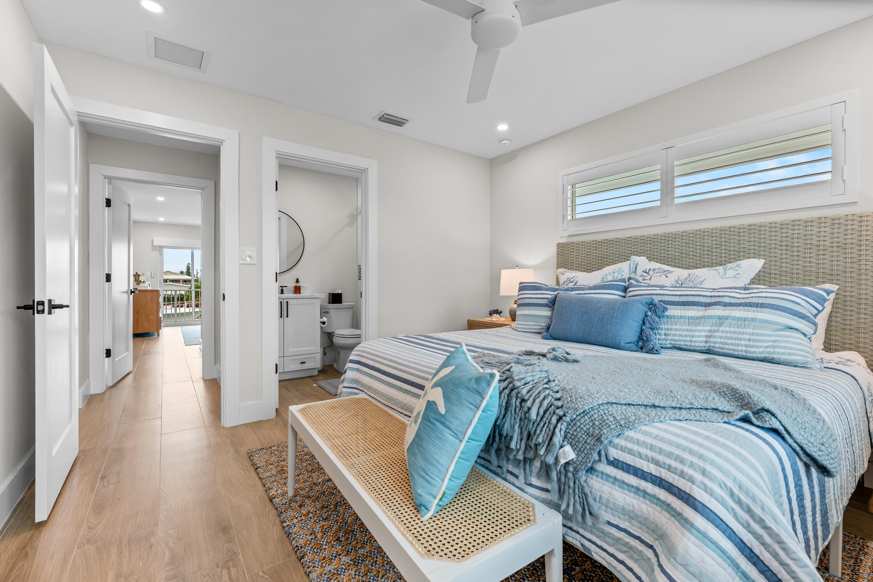 360 12th Street Key Colony Beach, FL 33051 - Photo 28 of 60 a spacious bedroom with a bed and wooden floor