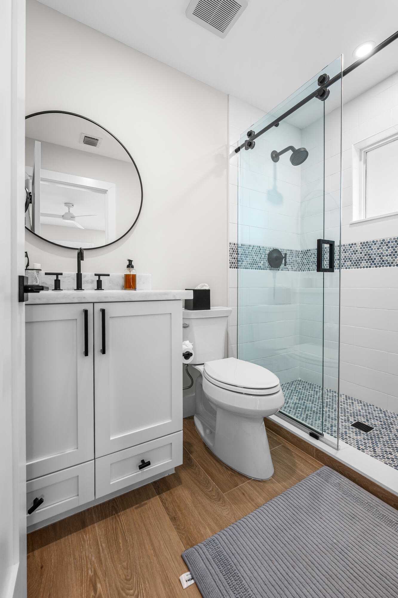 360 12th Street Key Colony Beach, FL 33051 - Photo 29 of 60 a bathroom with a toilet a sink and a mirror