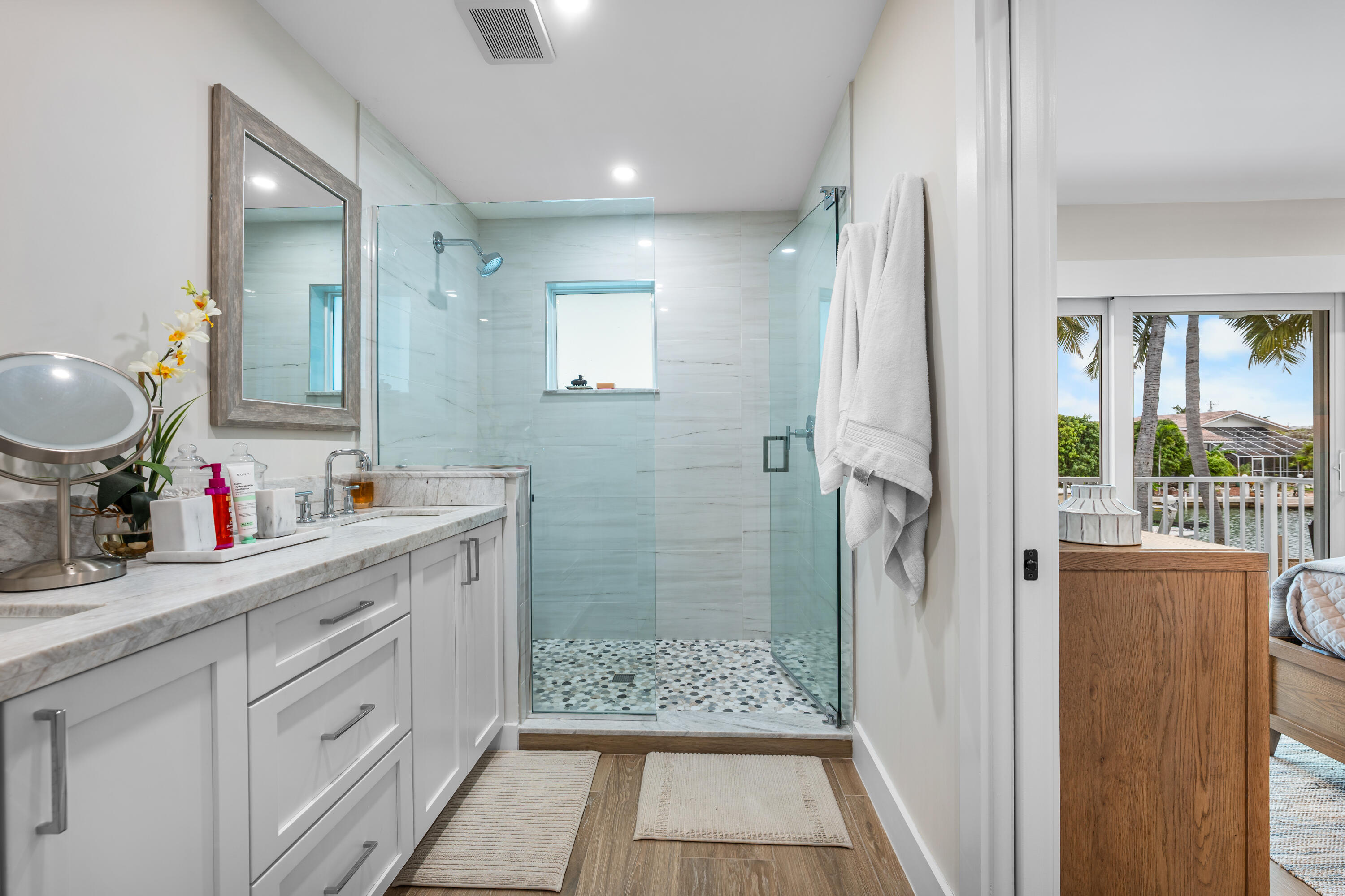 360 12th Street Key Colony Beach, FL 33051 - Photo 32 of 60 a bathroom with a double vanity sink and a mirror