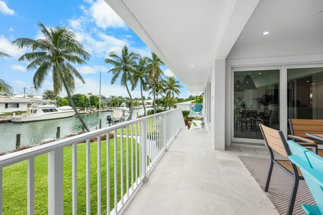 a work room with furniture and a large window