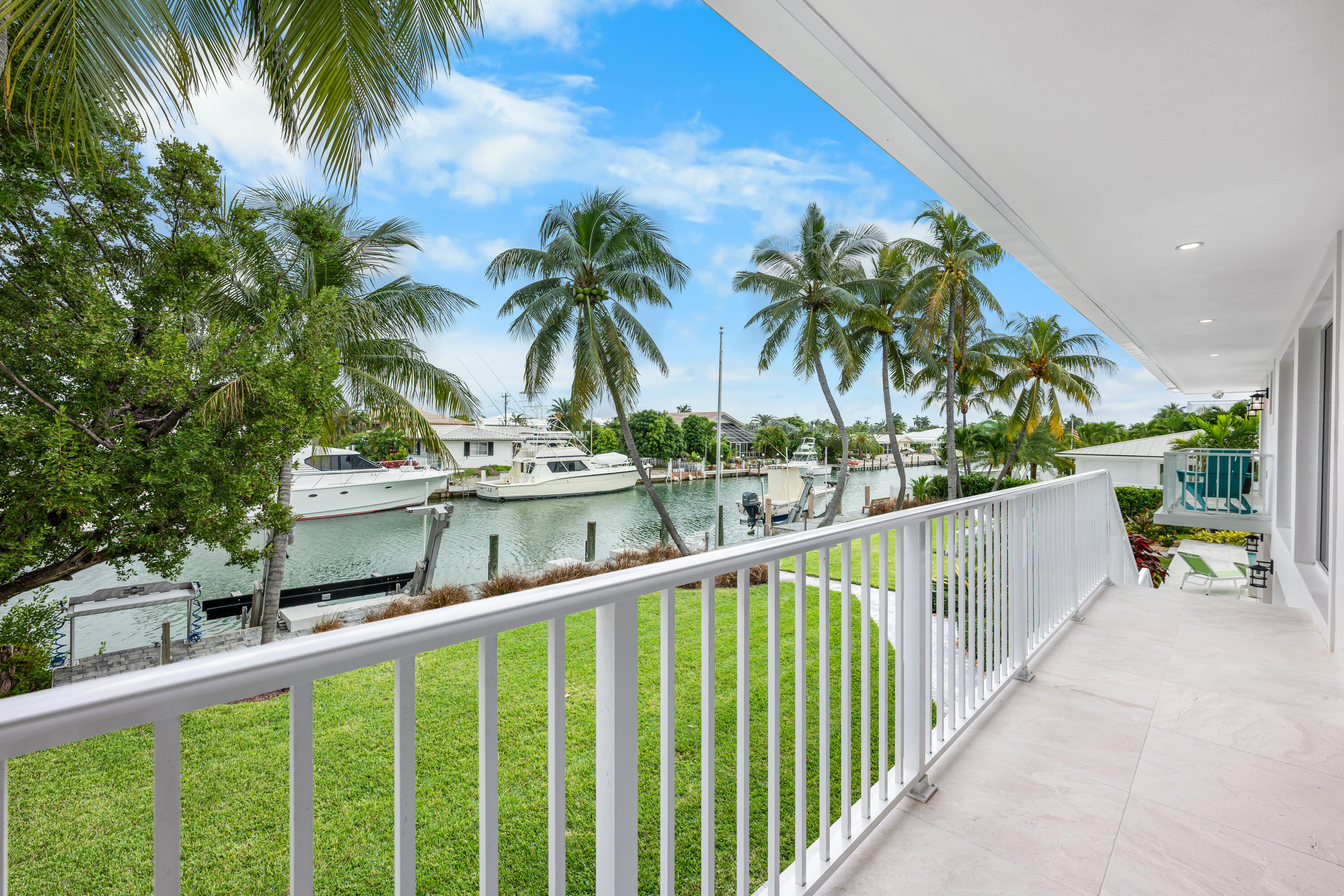 360 12th Street Key Colony Beach, FL 33051 - Photo 39 of 60 a view of a balcony with potted plants