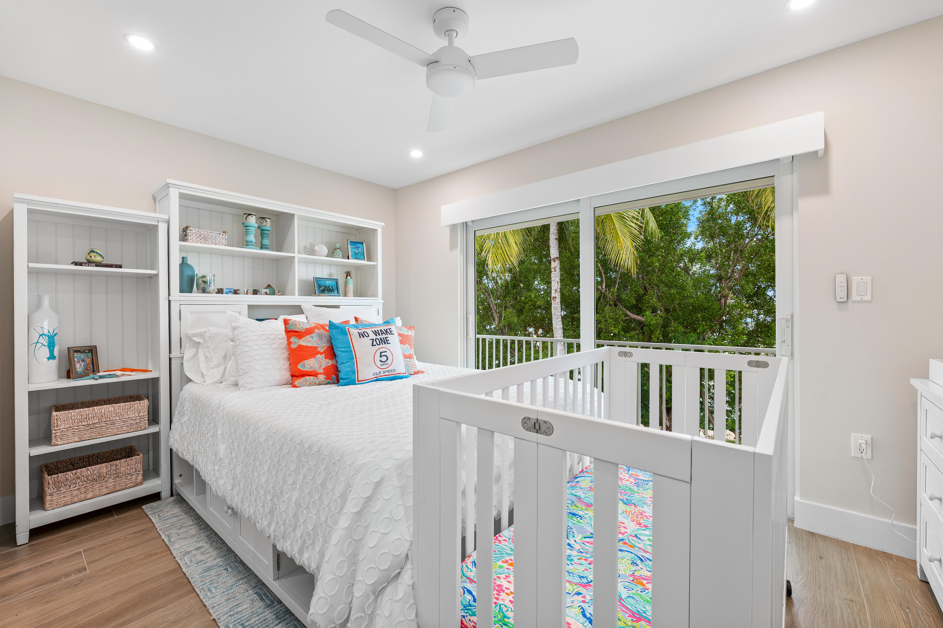 360 12th Street Key Colony Beach, FL 33051 - Photo 40 of 60 a bedroom with furniture and a large window