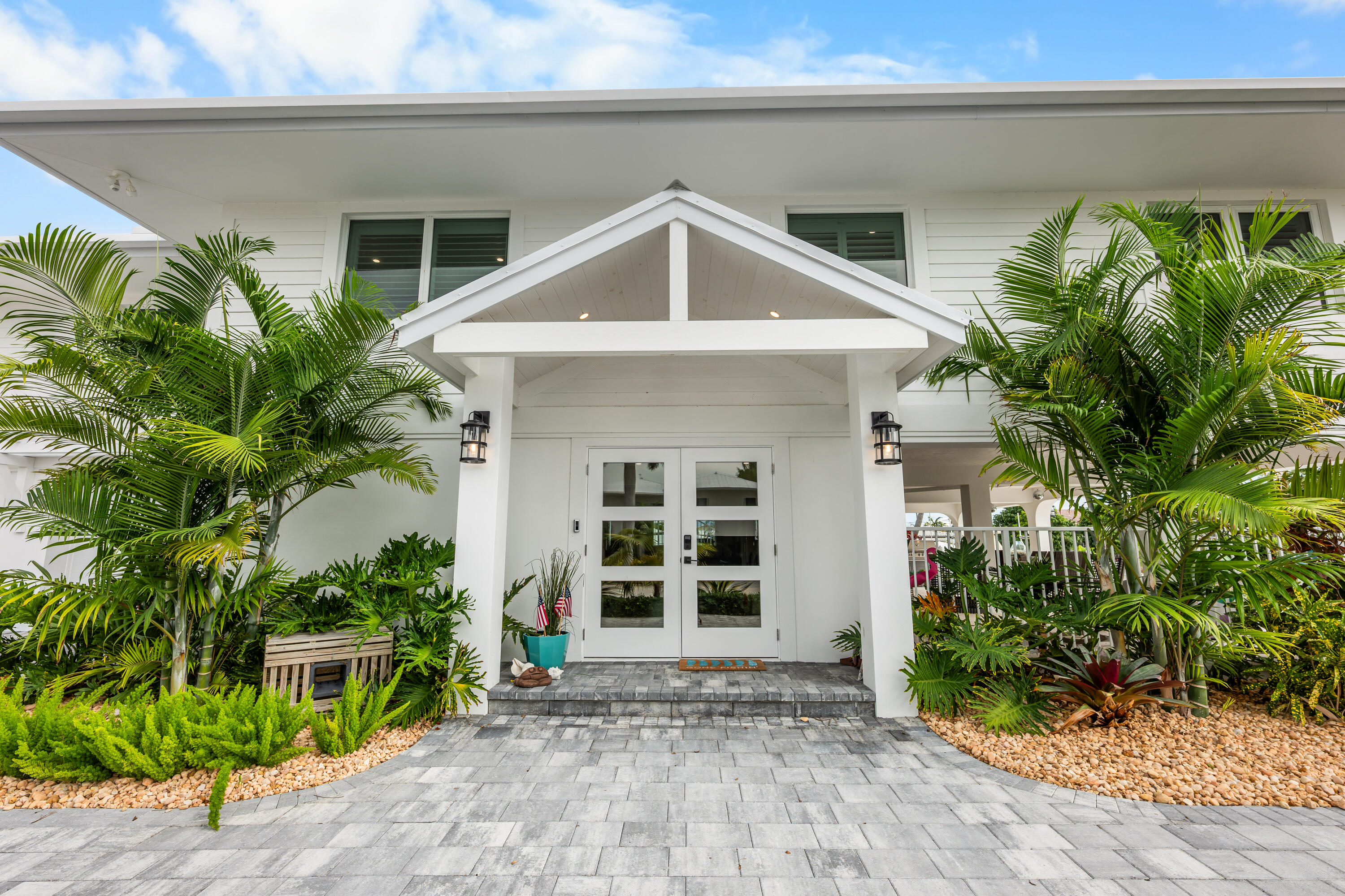 360 12th Street Key Colony Beach, FL 33051 - Photo 5 of 60 a front view of a house with garden
