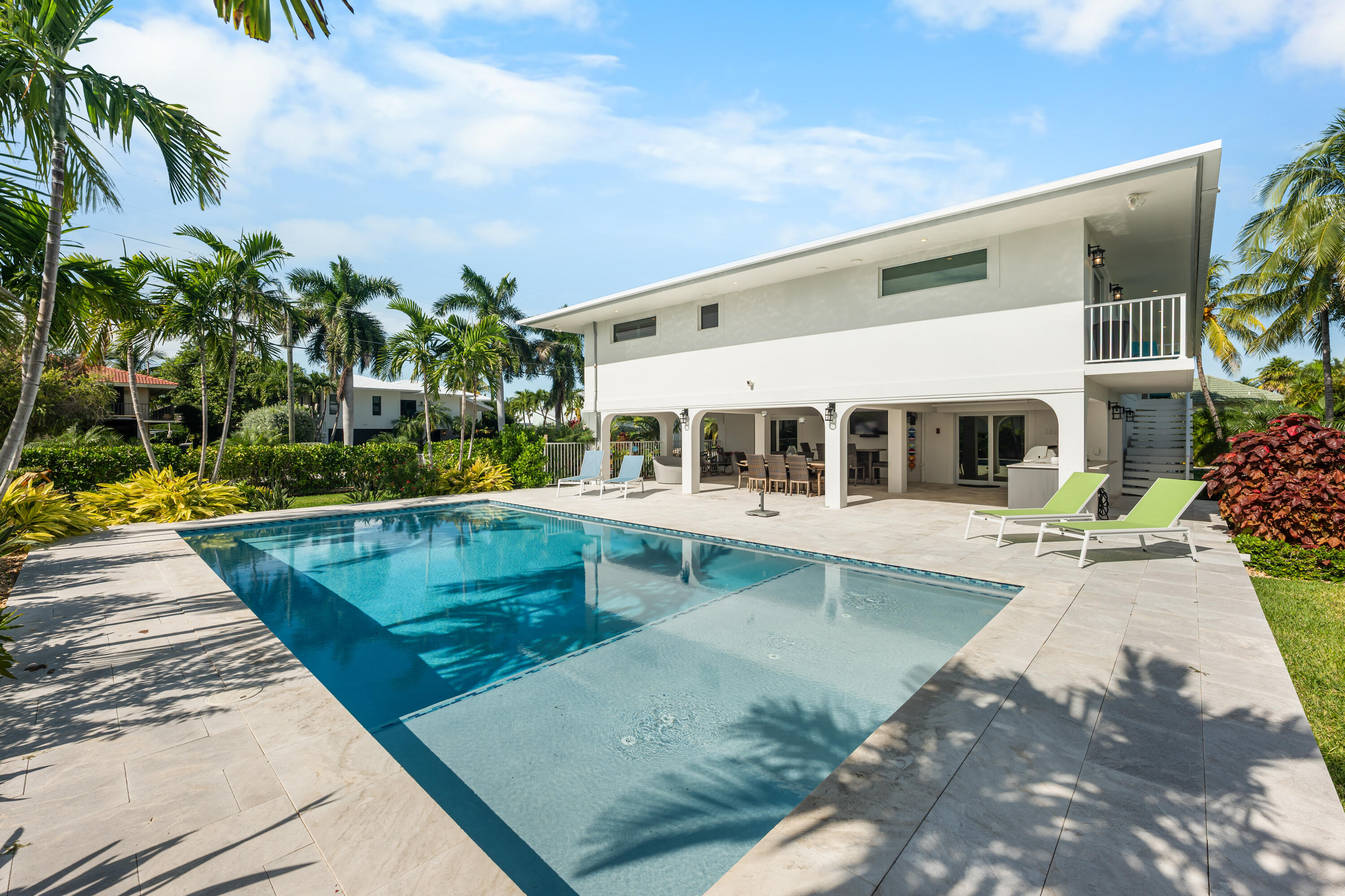 360 12th Street Key Colony Beach, FL 33051 - Photo 57 of 60 a view of a house with swimming pool