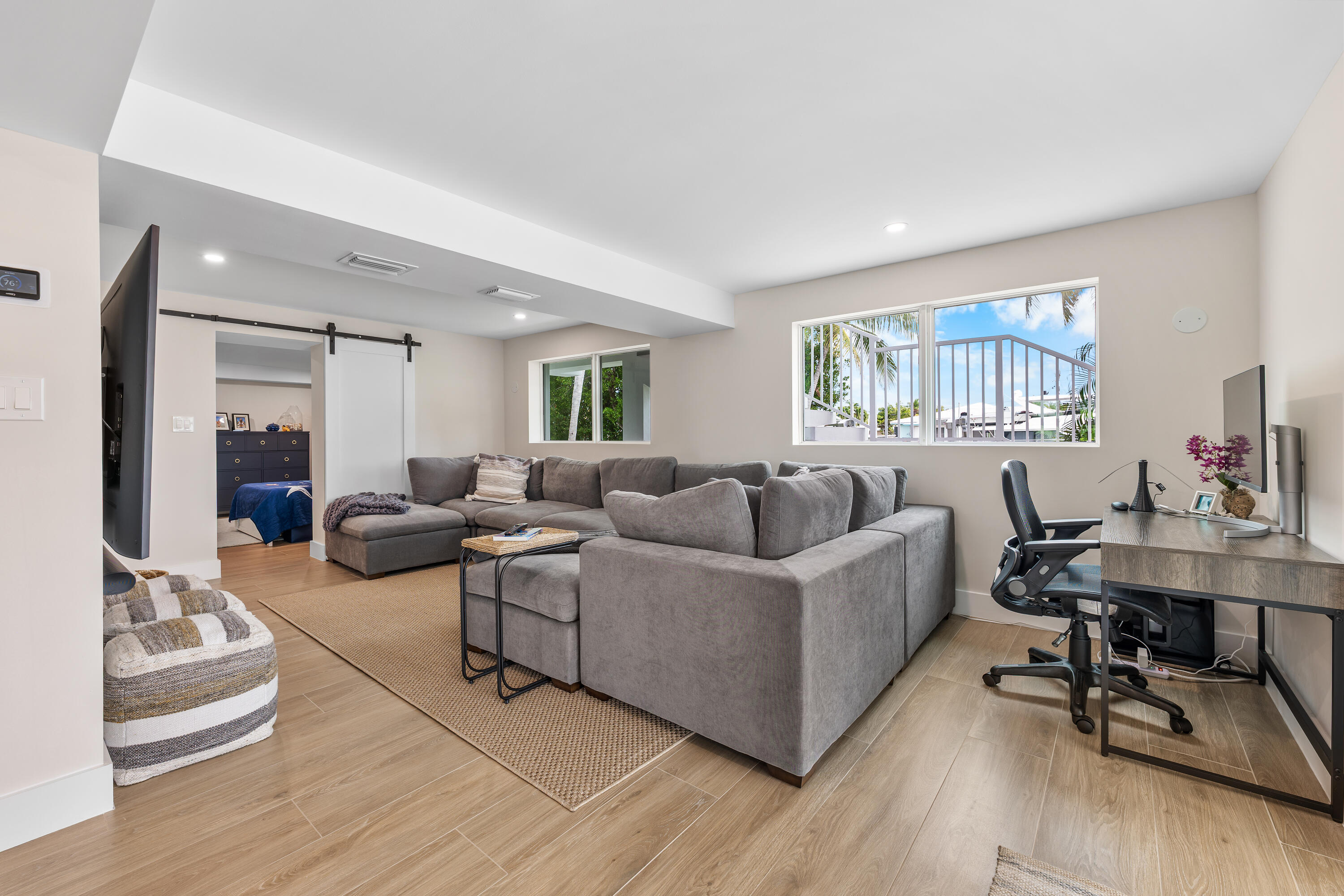 360 12th Street Key Colony Beach, FL 33051 - Photo 7 of 60 a living room with furniture wooden floor and a window