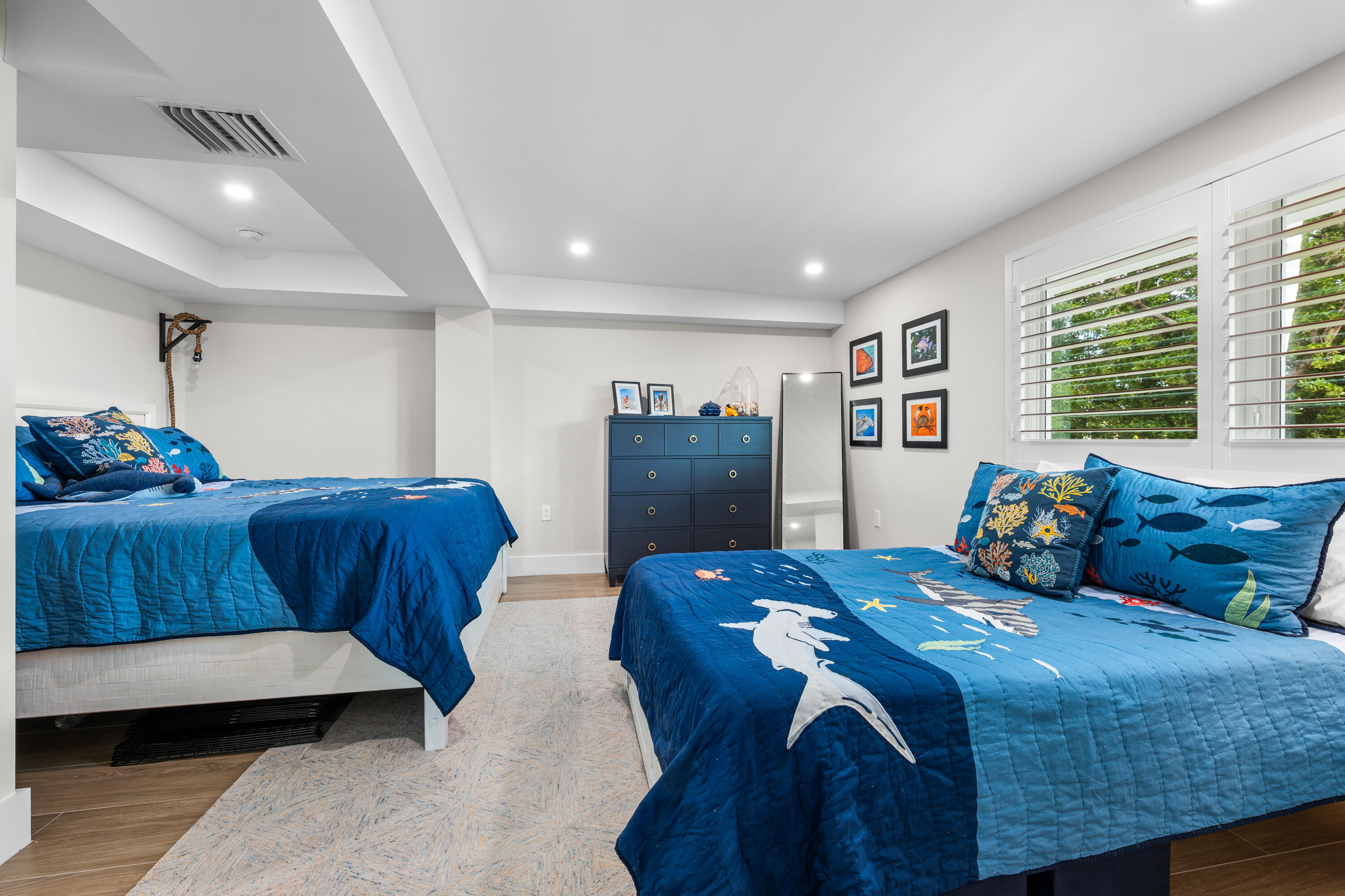 360 12th Street Key Colony Beach, FL 33051 - Photo 8 of 60 a bedroom with a bed and a dresser