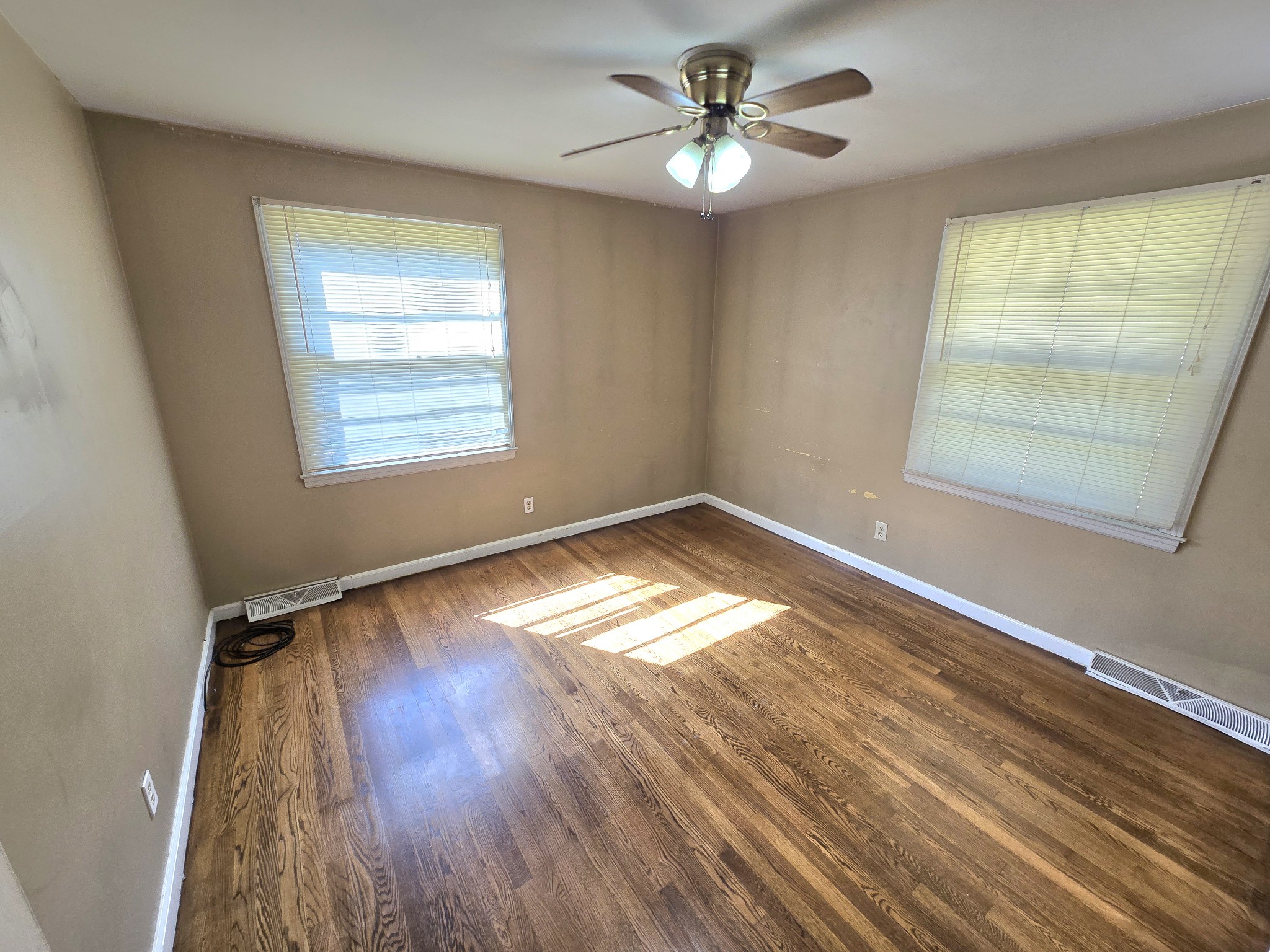213 Jackson Heights Road Columbia, TN 38401 - Photo 12 of 19 a view of empty room with wooden floor and fan