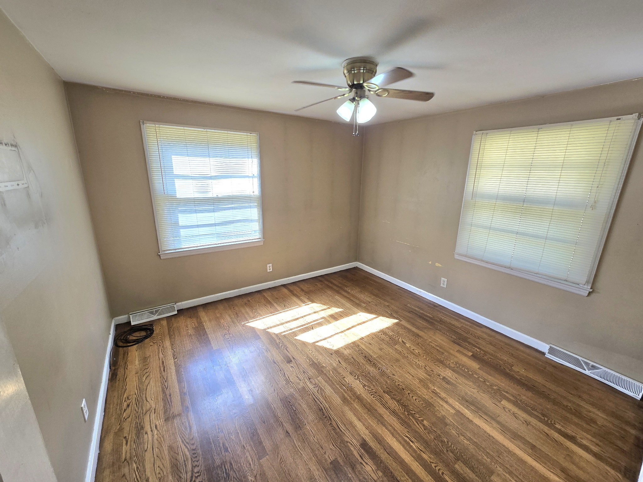 213 Jackson Heights Road Columbia, TN 38401 - Photo 13 of 19 a view of empty room with wooden floor and fan