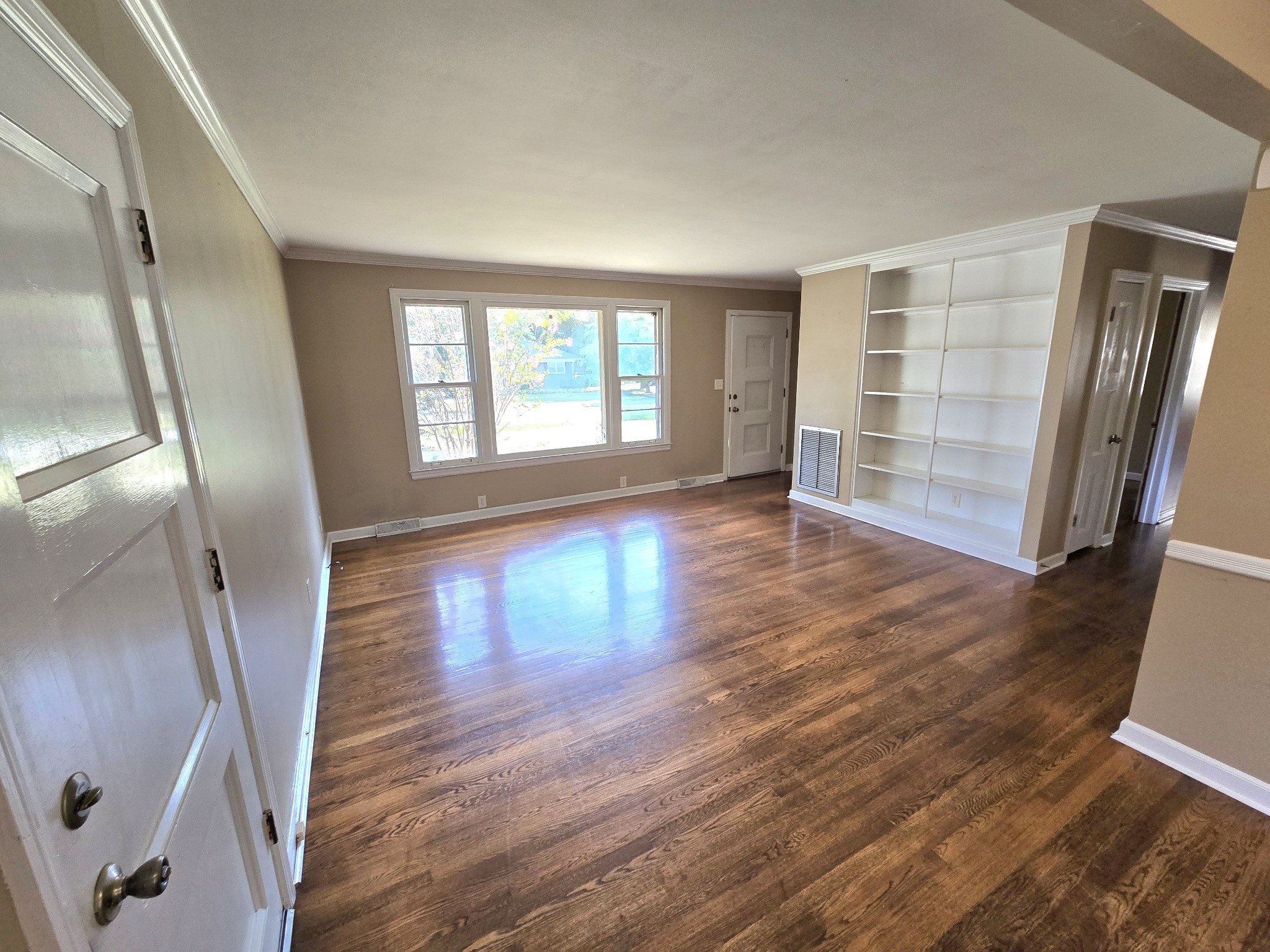 213 Jackson Heights Road Columbia, TN 38401 - Photo 3 of 19 wooden floor in an empty room with a window