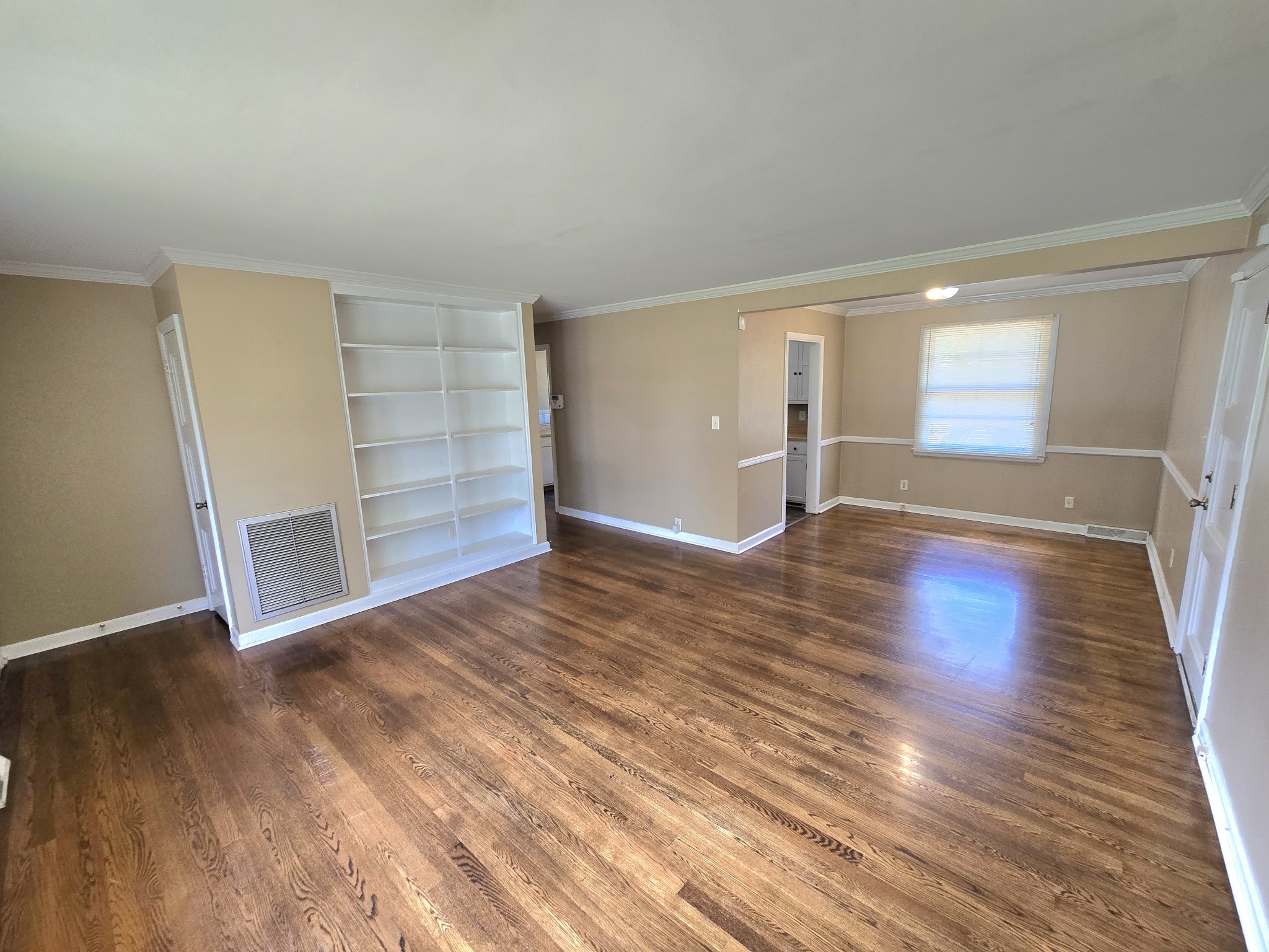 213 Jackson Heights Road Columbia, TN 38401 - Photo 5 of 19 wooden floor in an empty room with a window