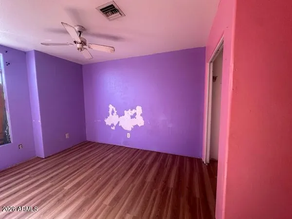 a view of a livingroom with wooden floor